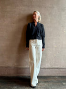 Swoman wearing PRWMN Mia Cardigan with 3 button closure and v-neck modest enough to wear alone or layering