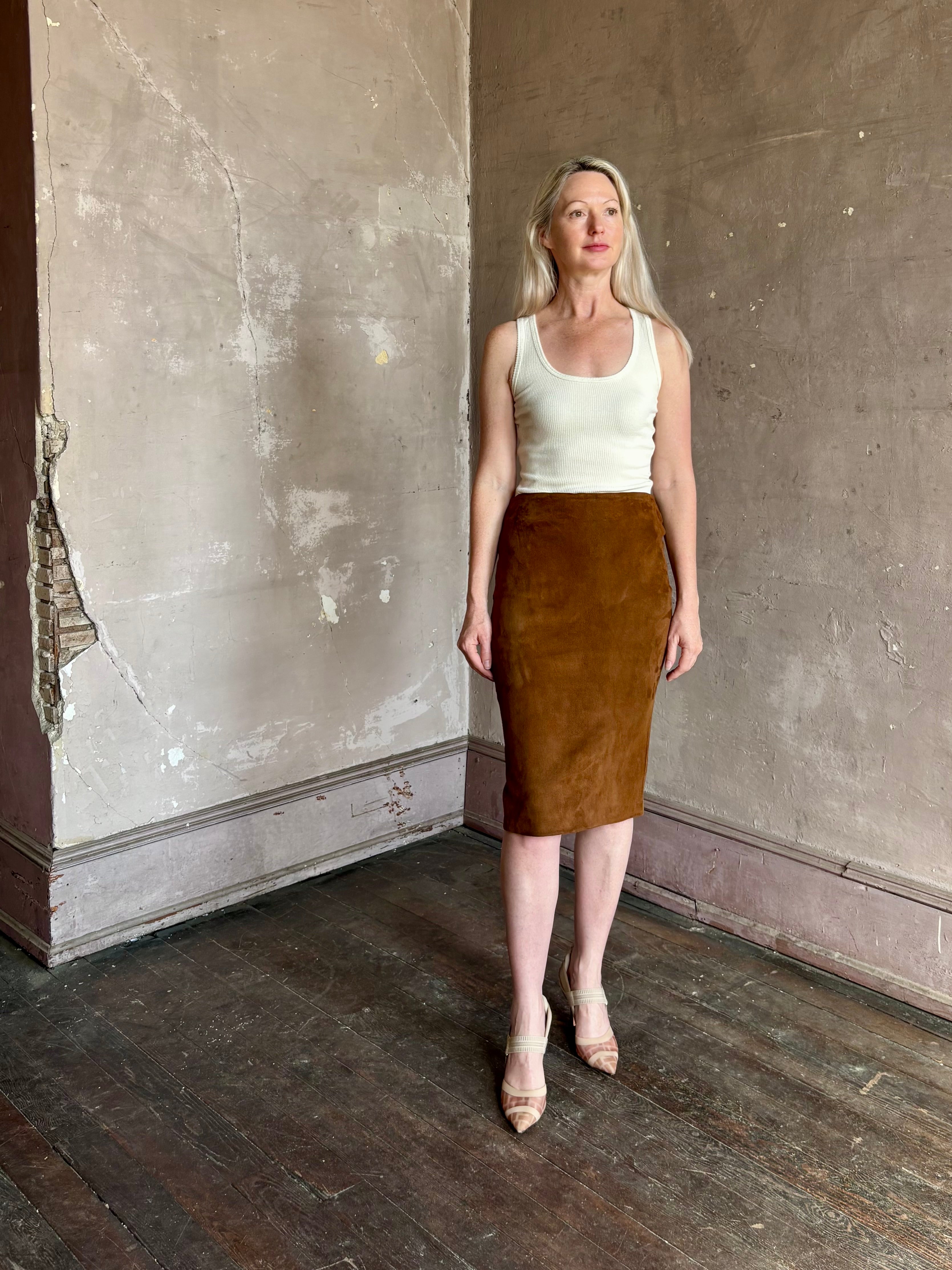 mature woman wearing contemporary designer SPRWMN brown suede leather pencil skirt medium brown