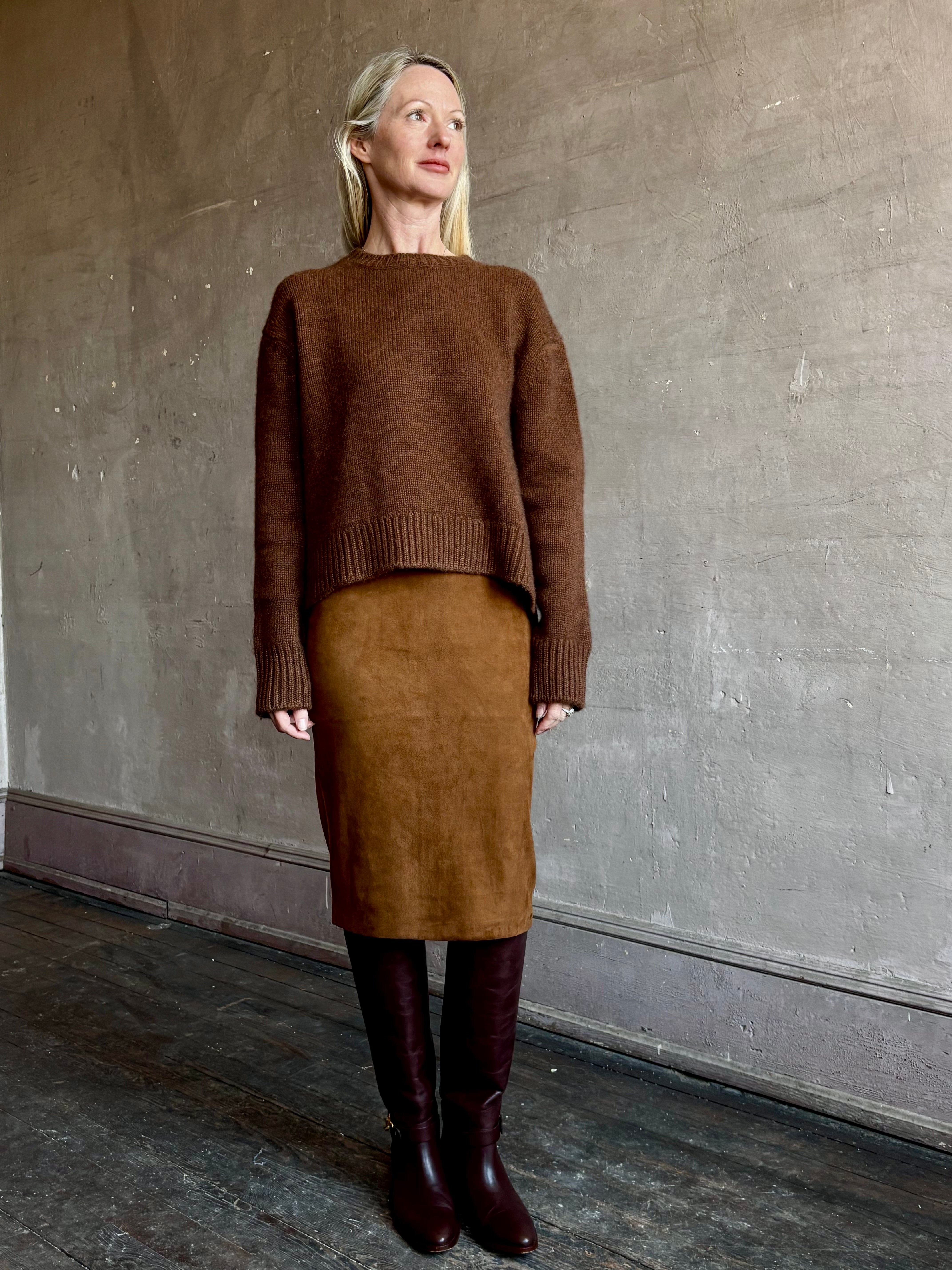 Image of mature woman wearing contemporary designer SPRWMN brown suede leather pencil skirt and cashmere sweater
