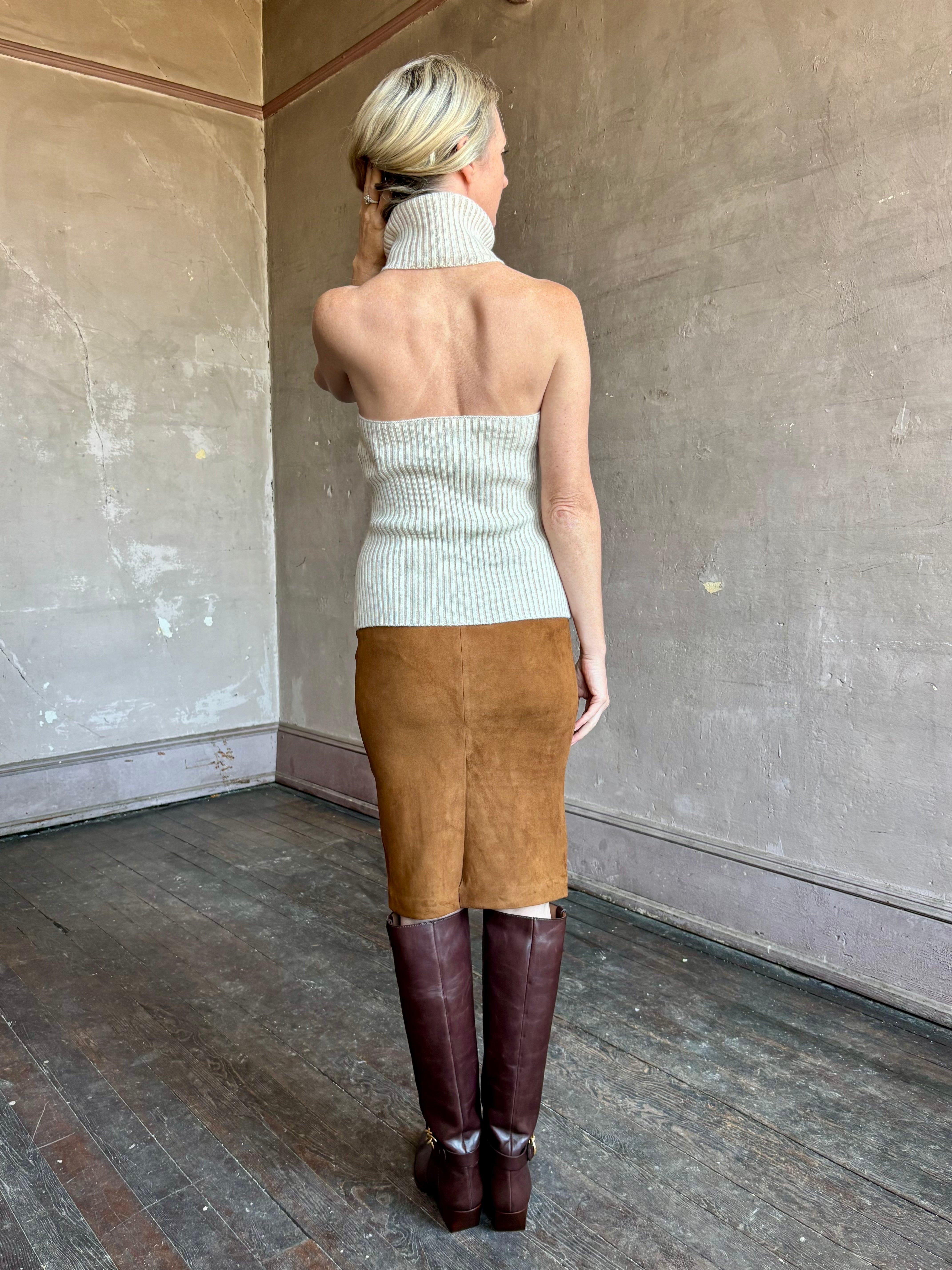 Image of mature woman wearing contemporary designer SPRWMN brown suede leather pencil skirt with back vent