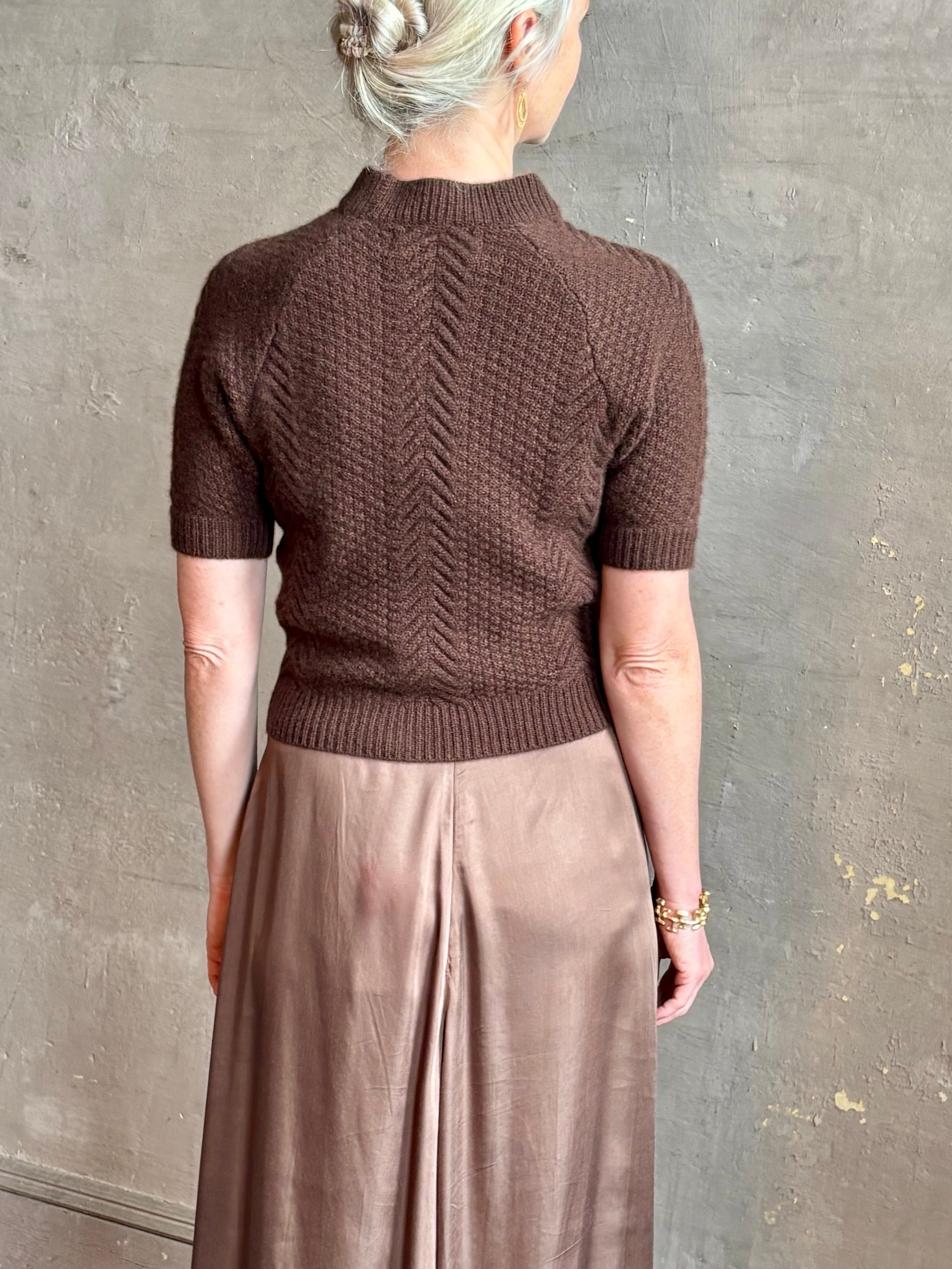 mature woman wearing luxury designer SPRWMN short sleeve brown cashmere sweater with cable texture crew neck