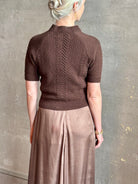 mature woman wearing luxury designer SPRWMN short sleeve brown cashmere sweater with cable texture crew neck
