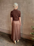 mature woman wearing luxury designer SPRWMN short sleeve brown cashmere sweater with cable texture crew neck