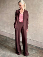 Image of woman wearing premium cashmere elevated casual pant and top set by SPRWMN with long sleeves