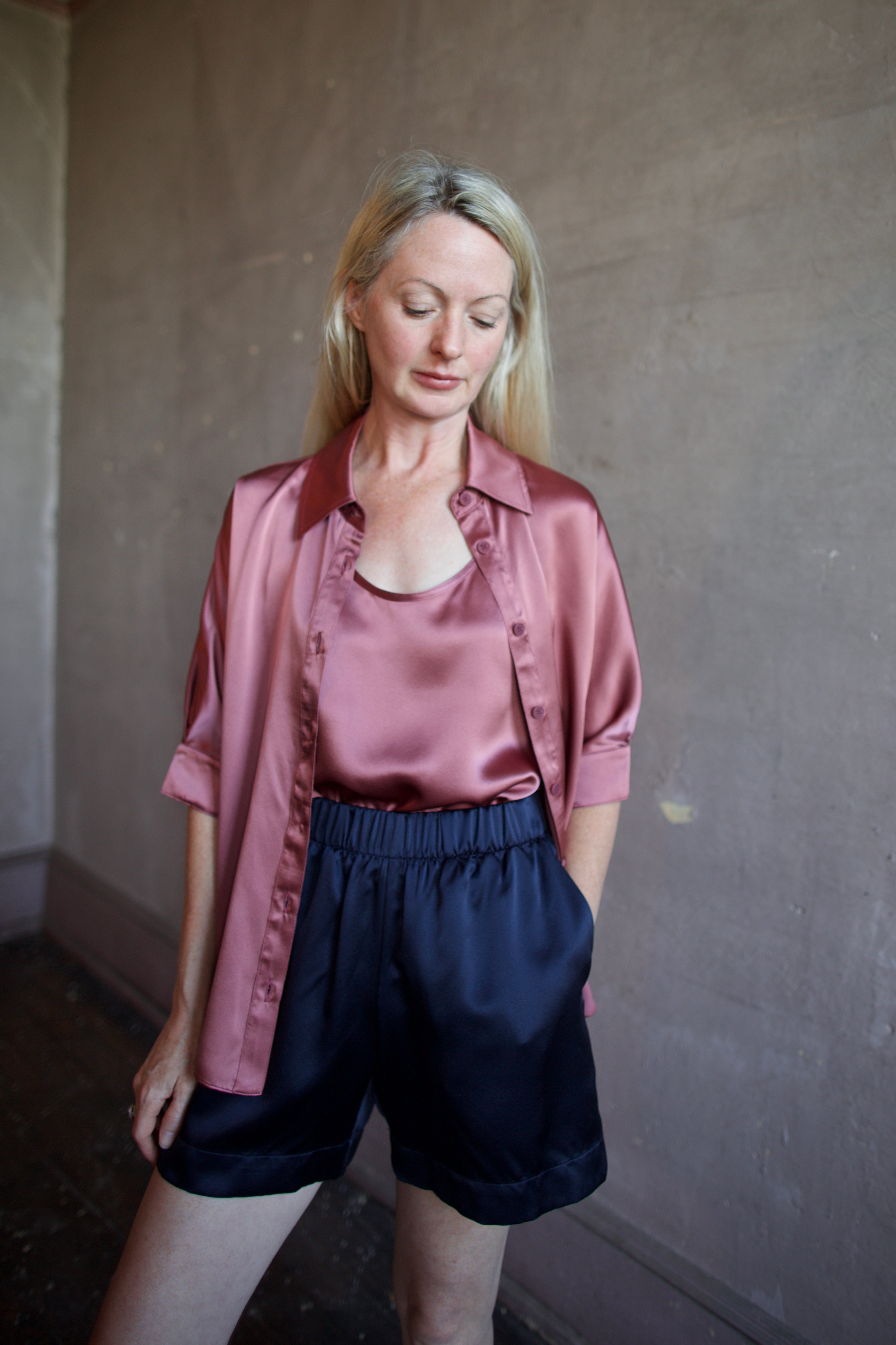 Image of a woman wearing the Sablyn Brynn Shorts, Claudia B Scoop Tank and Gisele B Button Down