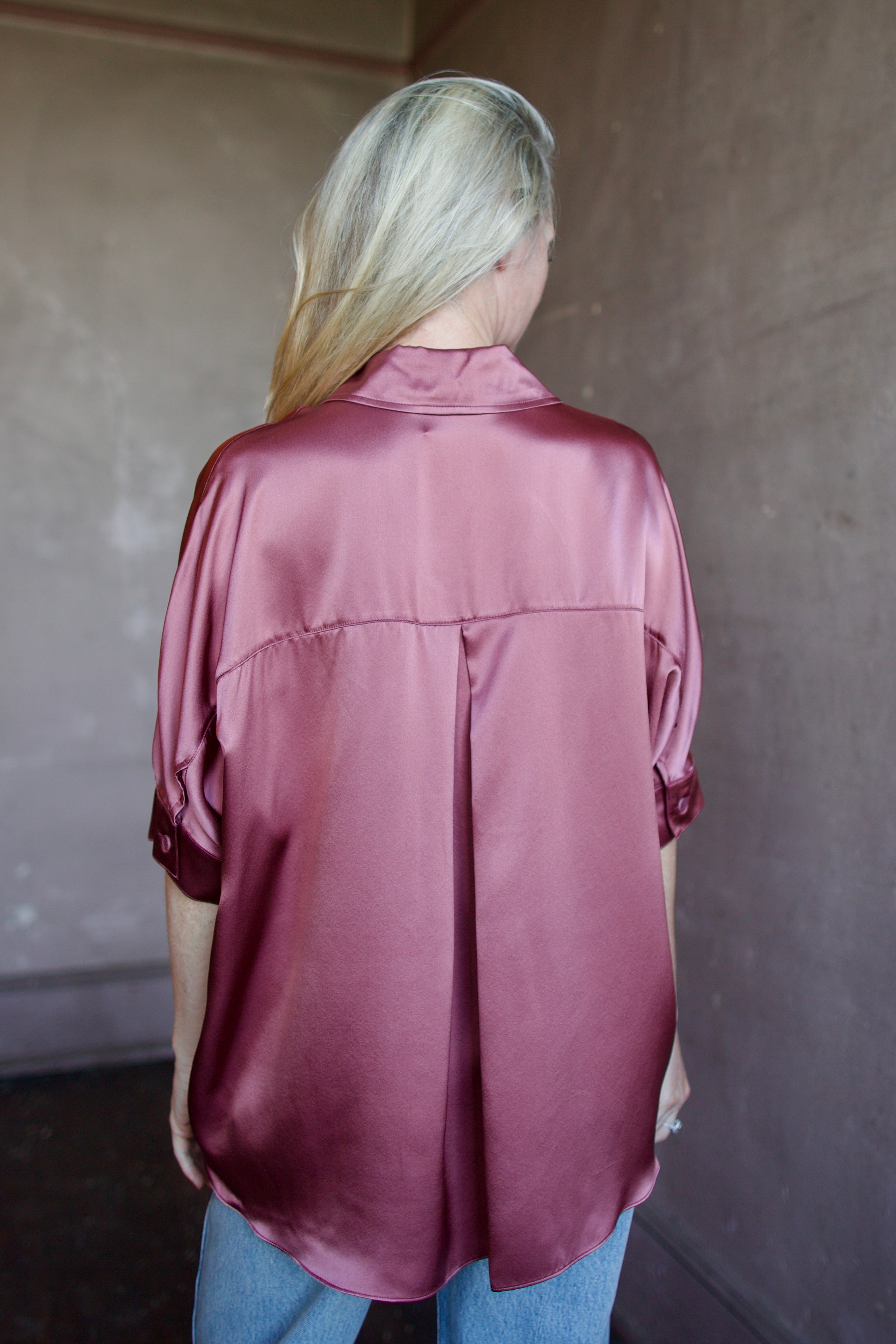 Model wearing luxury designer Sablyn silk charmeuse Gisele B relaxed short sleeve button down blouse with collar