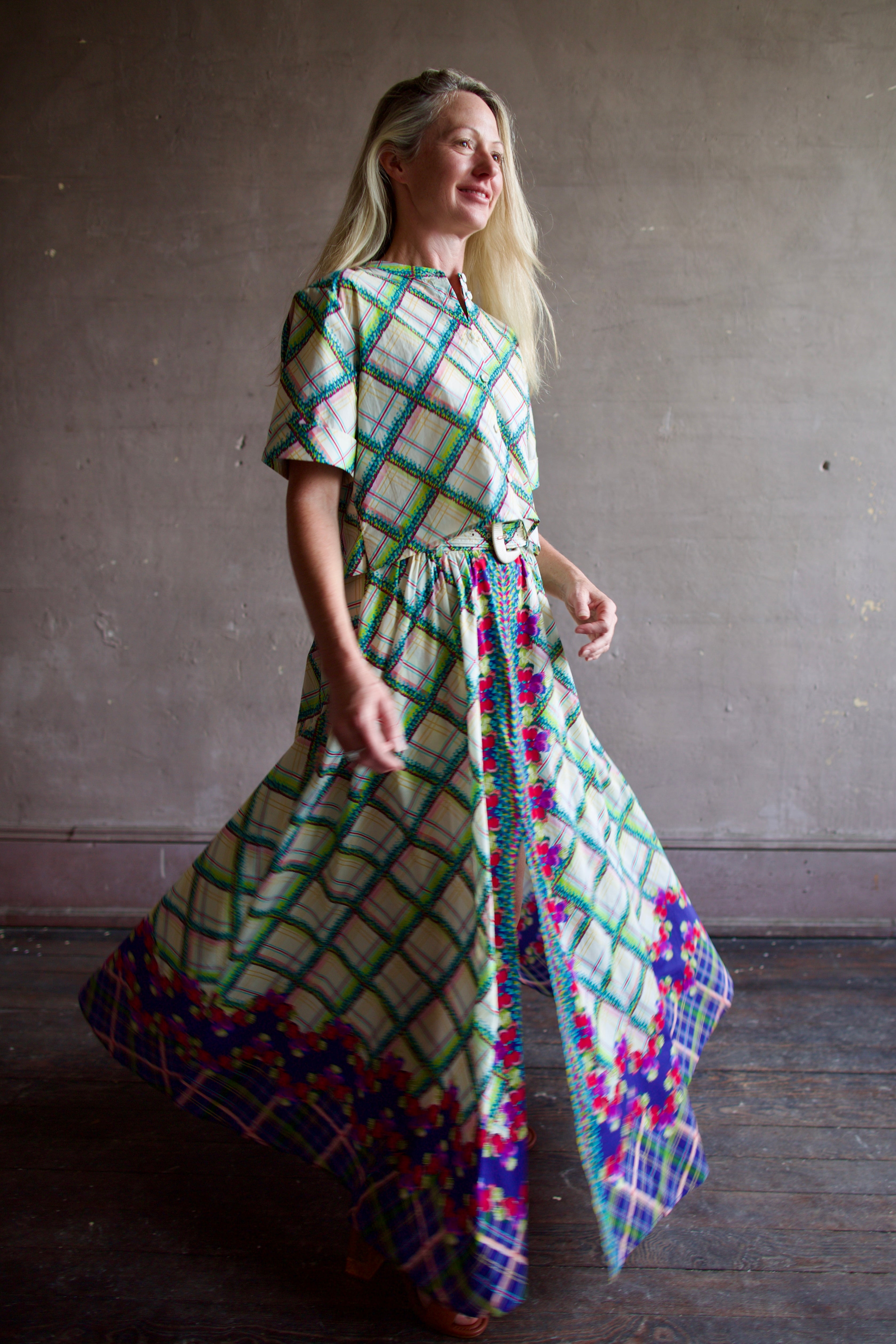 Mature woman wearing the Saloni Jude-B short sleeve plaid button up crop top crafted in cotton with happy diagonal green plaid expertly aligned pattern and matching skirt as a set