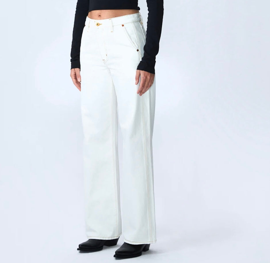 Image featuring a woman wearing he Grace Slvrlake cotton rigid denim high-rise, wide leg jeans with a double side seams, slanted side pockets in ecru.