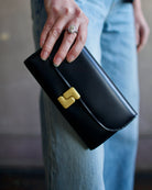 Image of luxury women's black leather Soeur Anita Wallet featuring magnetic closure with multiple card compartments and interior zip pouch 