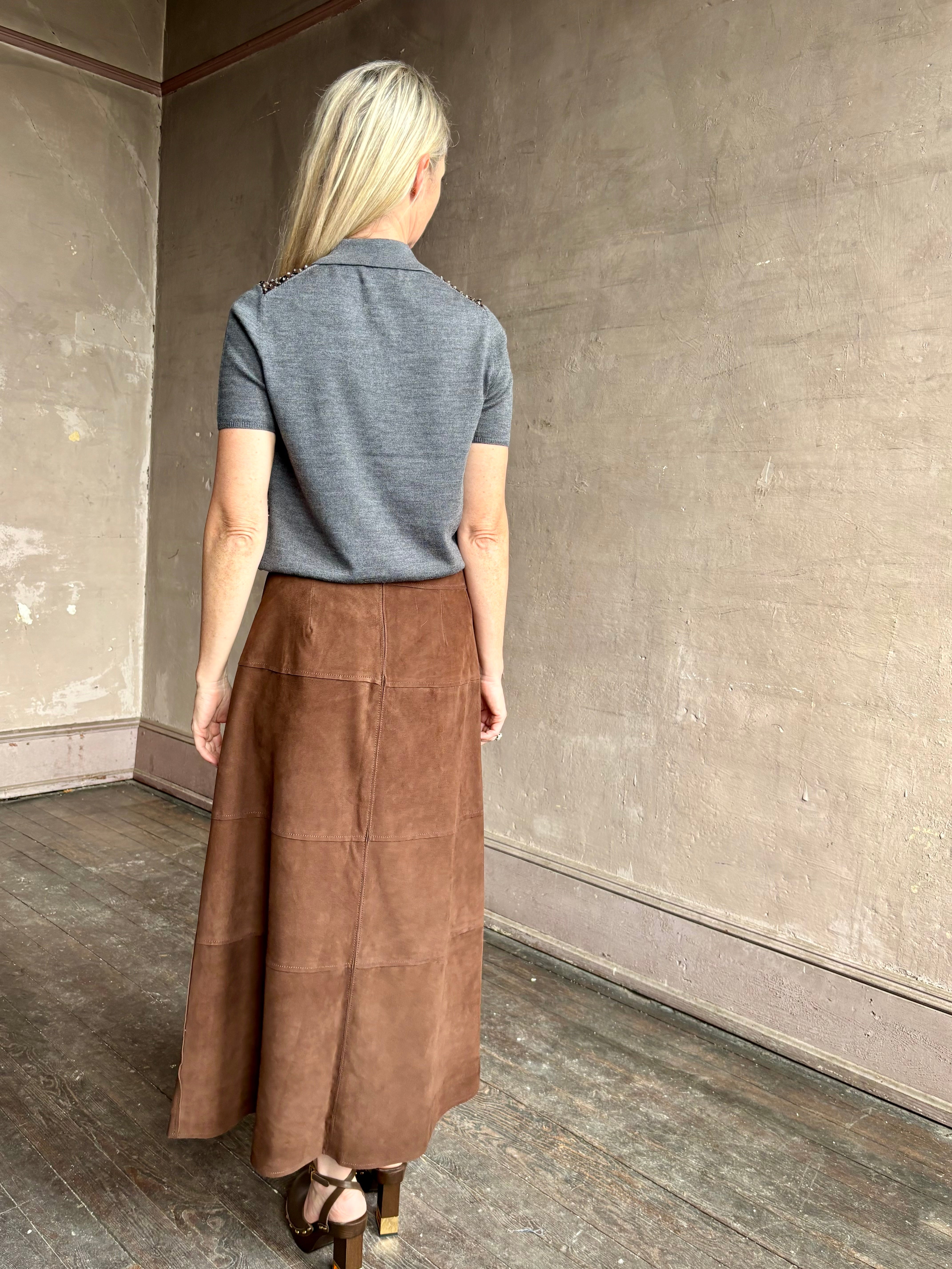 Image of mature woman wearing contemporary designer Tanya Taylor luxurious Suede classic A-Line Hudson Skirt in Chocolate brown