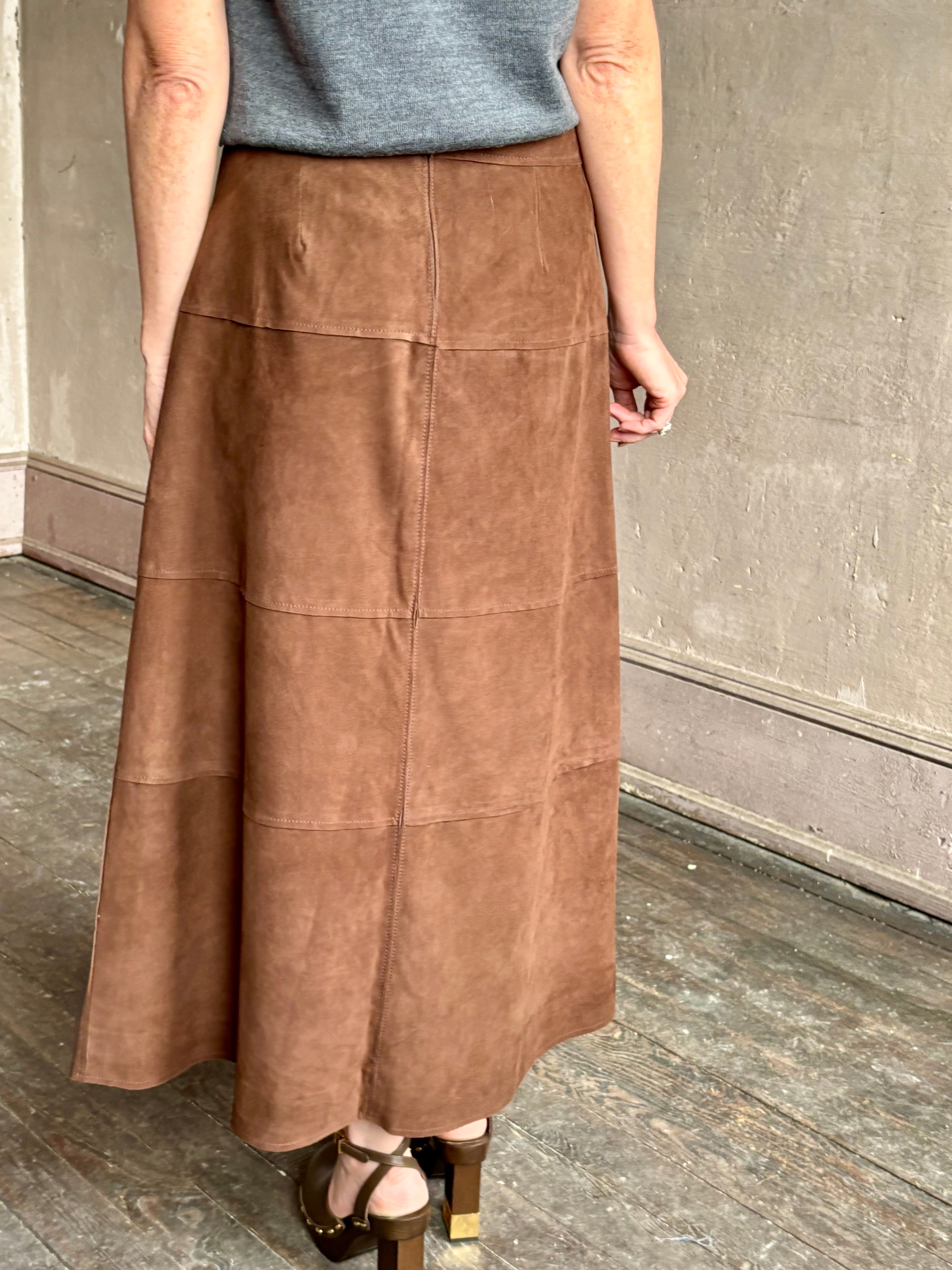 Image of mature woman wearing contemporary designer Tanya Taylor luxurious Suede classic A-Line Hudson Skirt in Chocolate brown