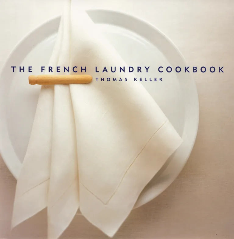 Book cover of 'The French Laundry Cookbook' by Thomas Keller with a white plate and napkin.