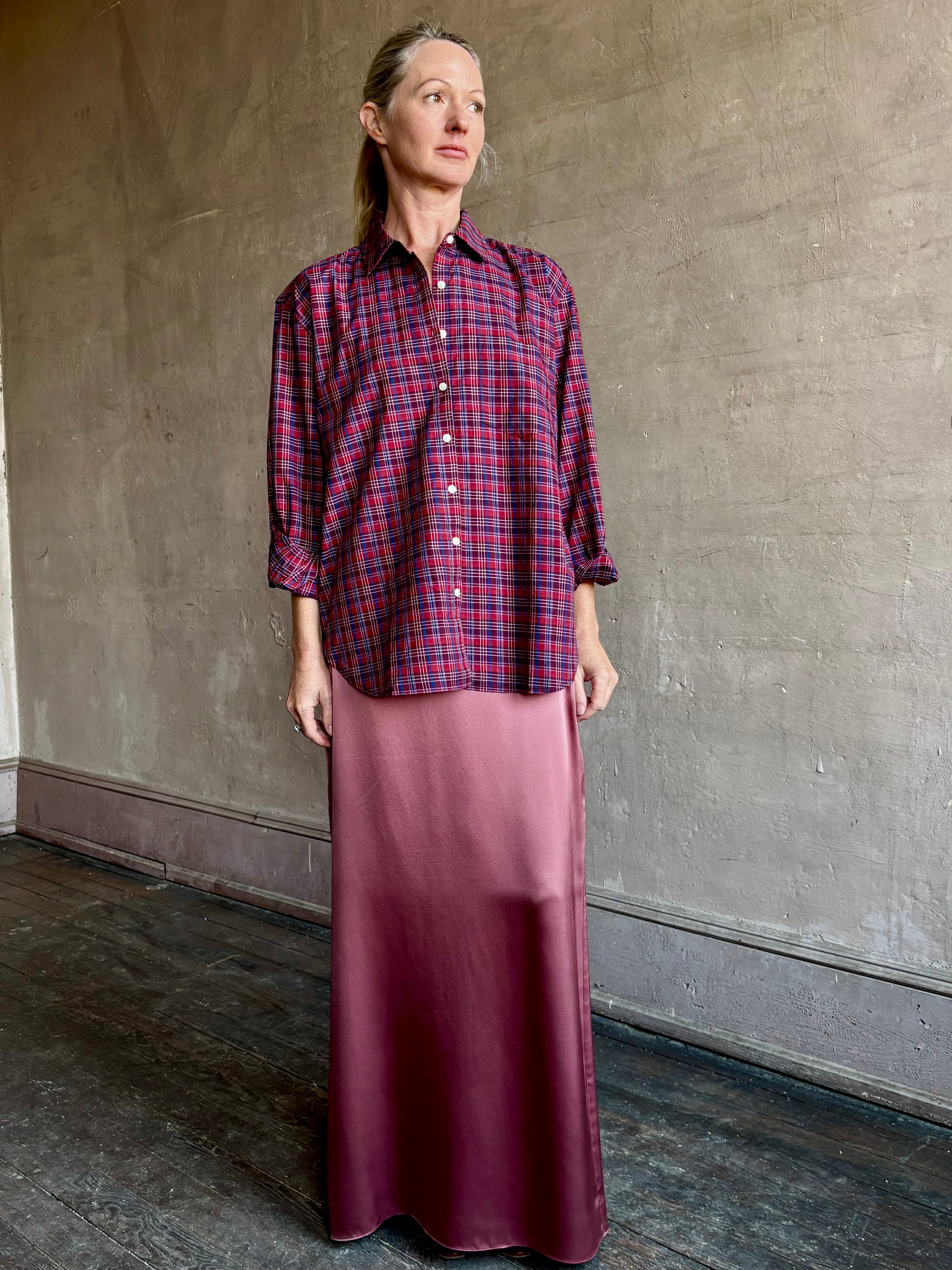 Image of mature woman wearing Trovata Blake Oversized premium cotton button down long sleeve Shirt in Mulled Wine Plaid 
