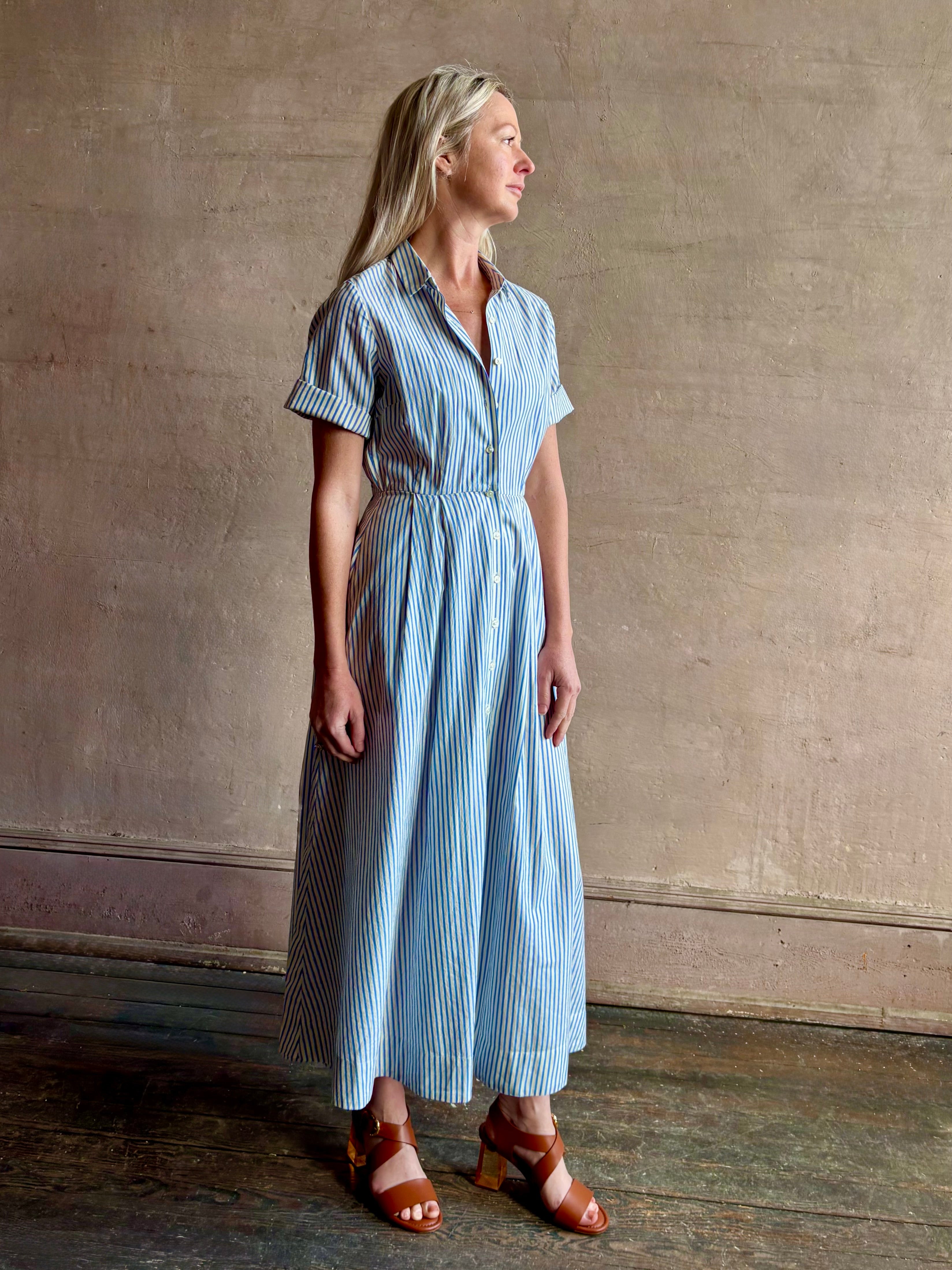 Image of woman wearing timeless TROVATA Aster A-line cotton shirt maxi Dress in Seaside blue and white Stripe and expert tailoring