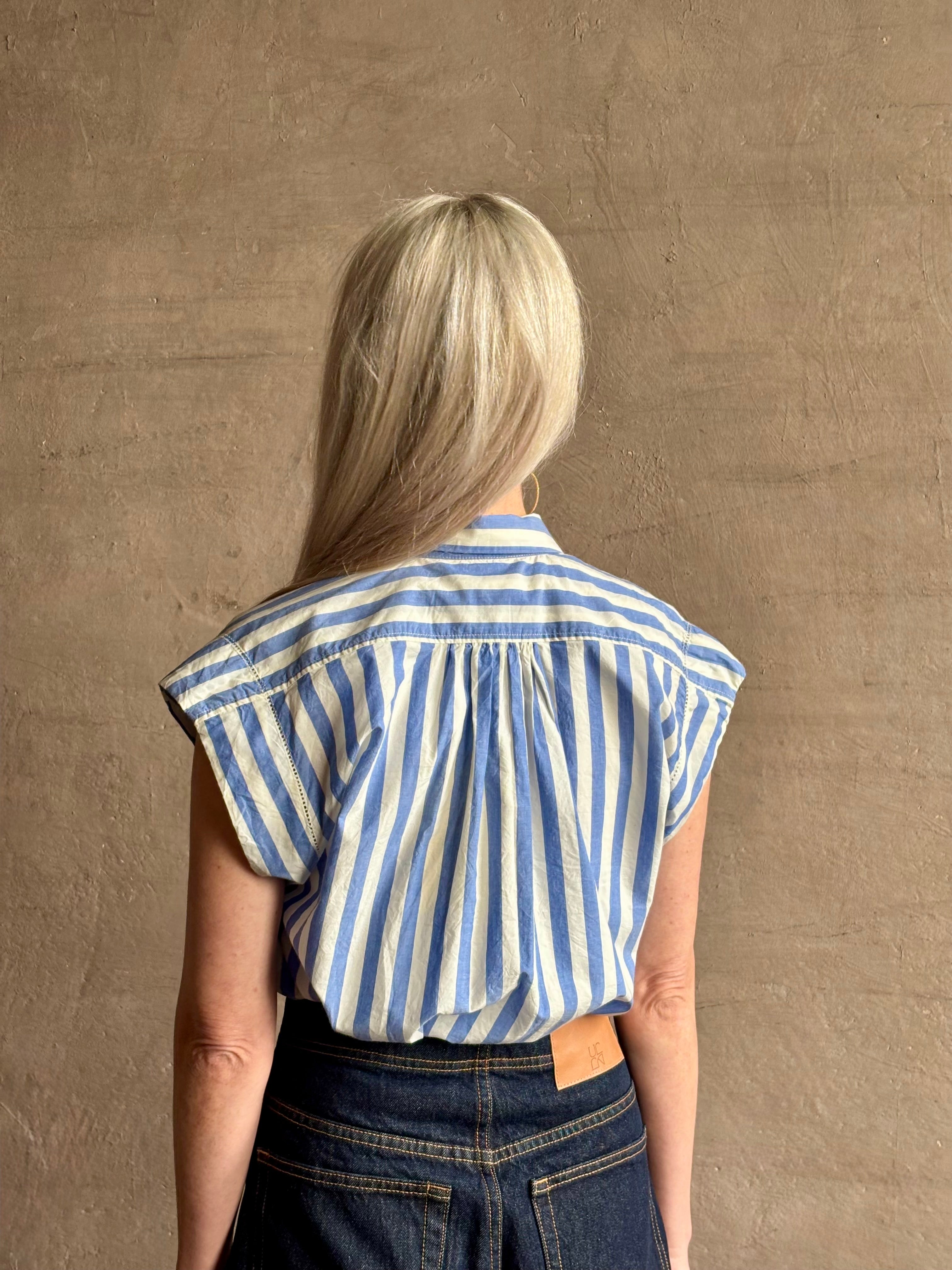 Mature woman wearing elevated everyday short sleeve cotton button-down Della Shirt from Trovata in a playful blue and white summer stripe