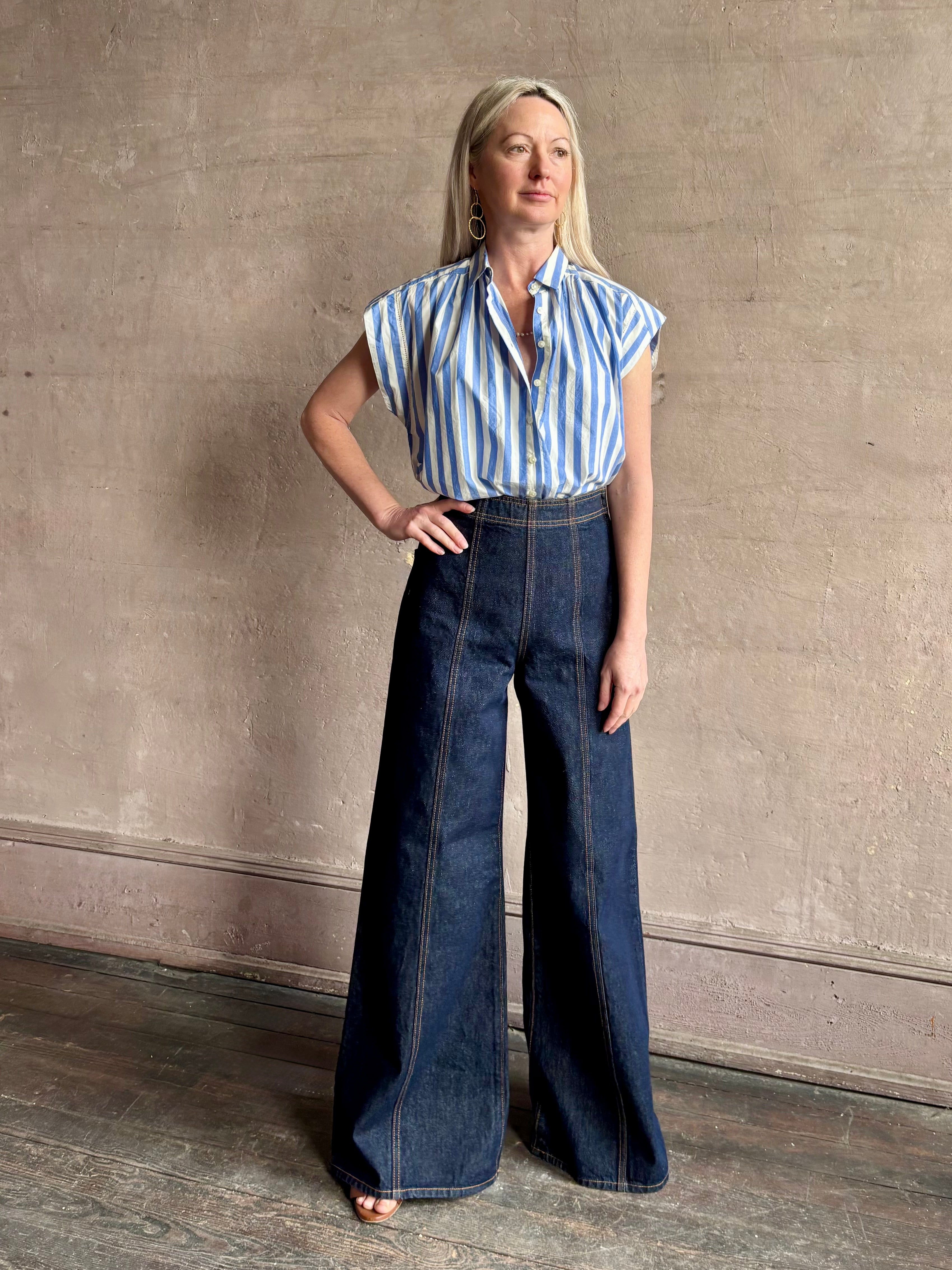 Mature woman wearing elevated everyday short sleeve cotton button-down Della Shirt from Trovata in a playful blue and white summer stripe