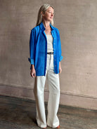 Image of woman wearing the ultimate casual elegance TROVATA Emilia cotton blend button down long sleeve Shirt in Cerulean blue contemporary floral print 