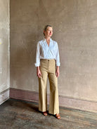 woman wearing white Trovata Justine blouse collared V-neck button-front closure cuffed long sleeves classic silhouette 