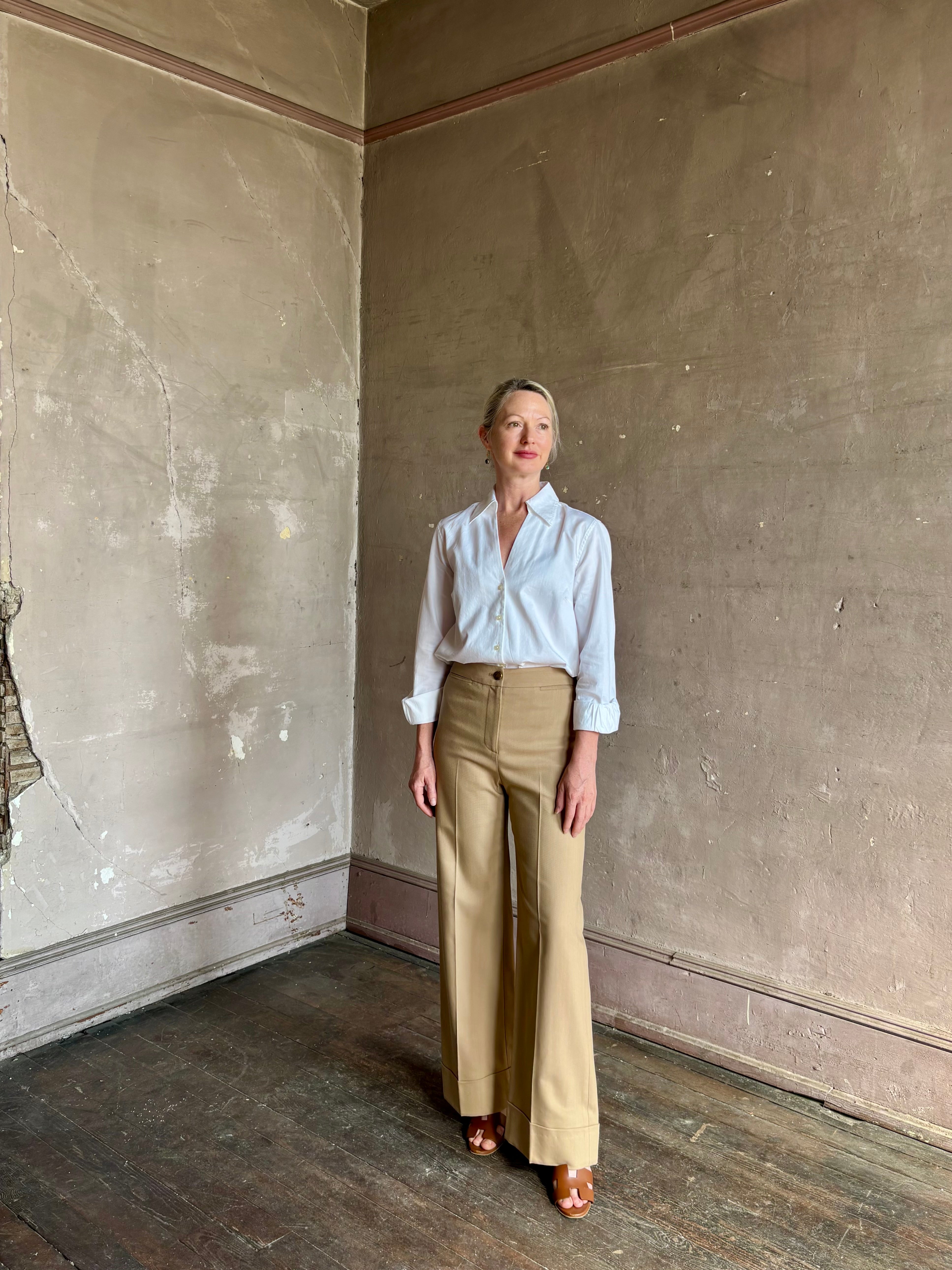 woman wearing white Trovata Justine blouse collared V-neck button-front closure cuffed long sleeves classic silhouette 