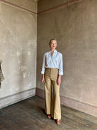 woman wearing white Trovata Justine blouse collared V-neck button-front closure cuffed long sleeves classic silhouette 