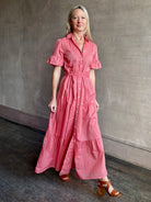 Image of woman wearing  TROVATA Martine button down cotton shirt dress in Rosdo rose with feminine ruffle sleeves and tiered skirt