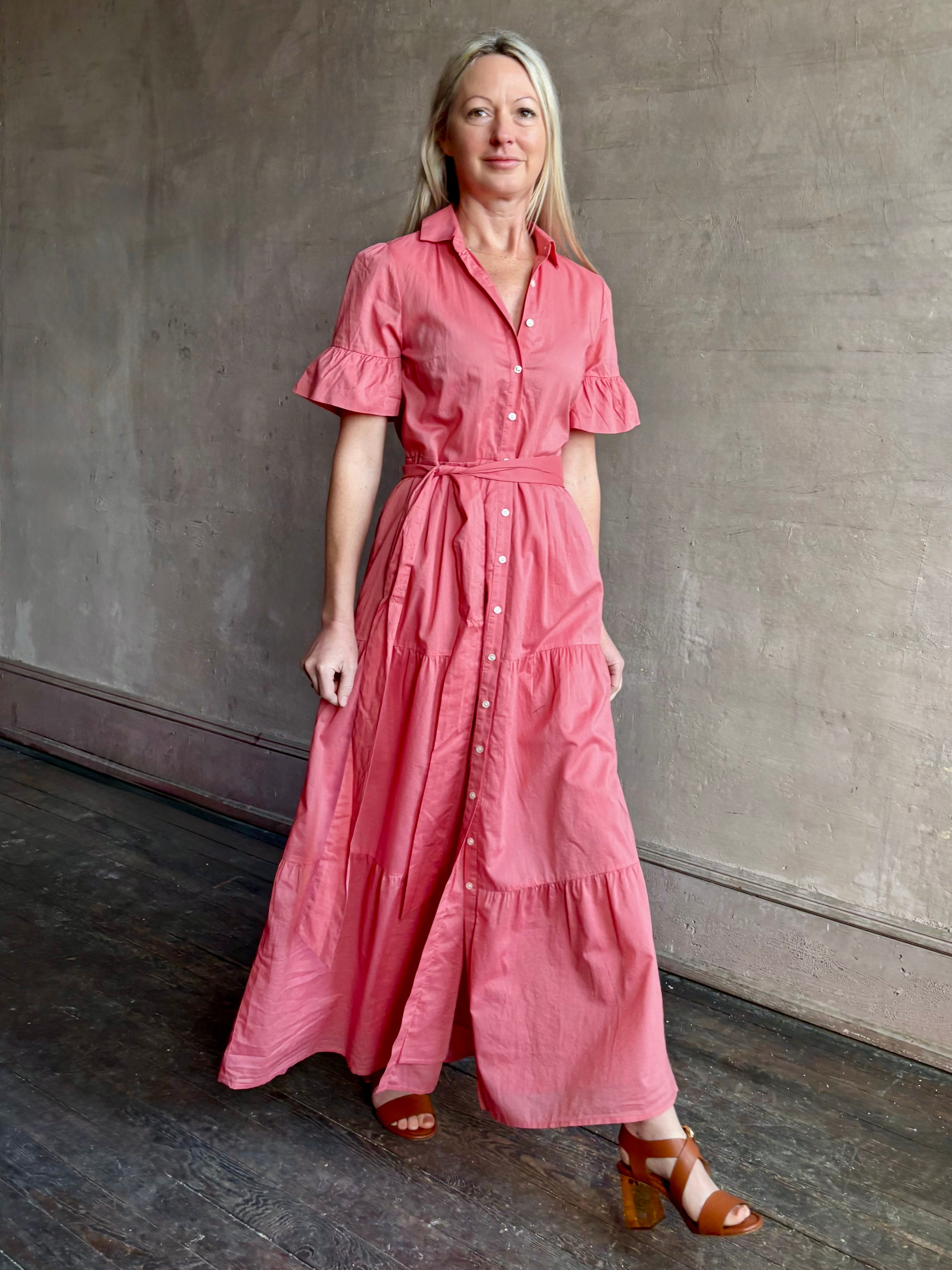 Image of woman wearing  TROVATA Martine button down cotton shirt dress in Rosdo rose with feminine ruffle sleeves and tiered skirt