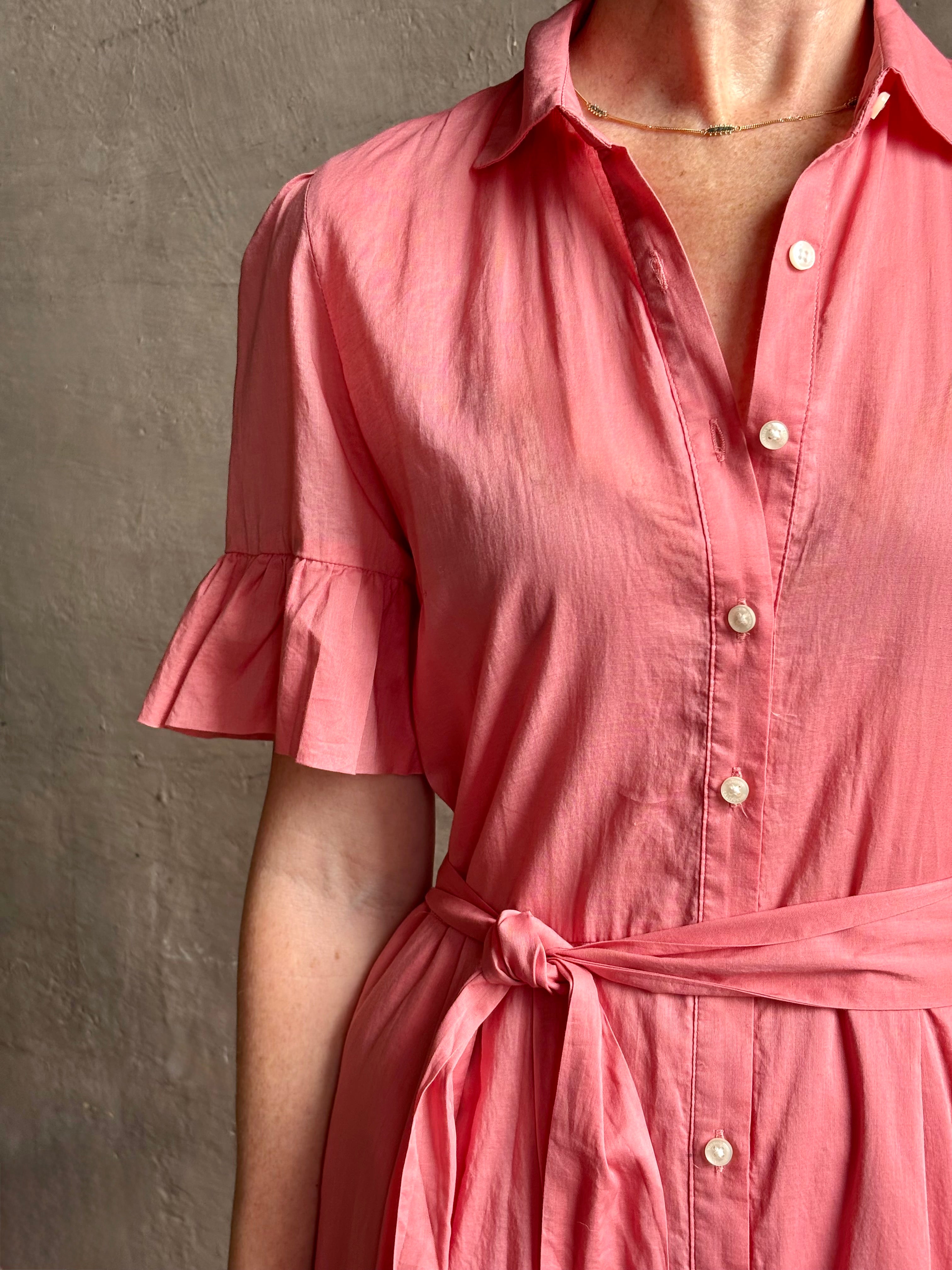 Image of woman wearing  TROVATA Martine button down cotton shirt dress in Rosdo rose with feminine ruffle sleeves and tiered skirt