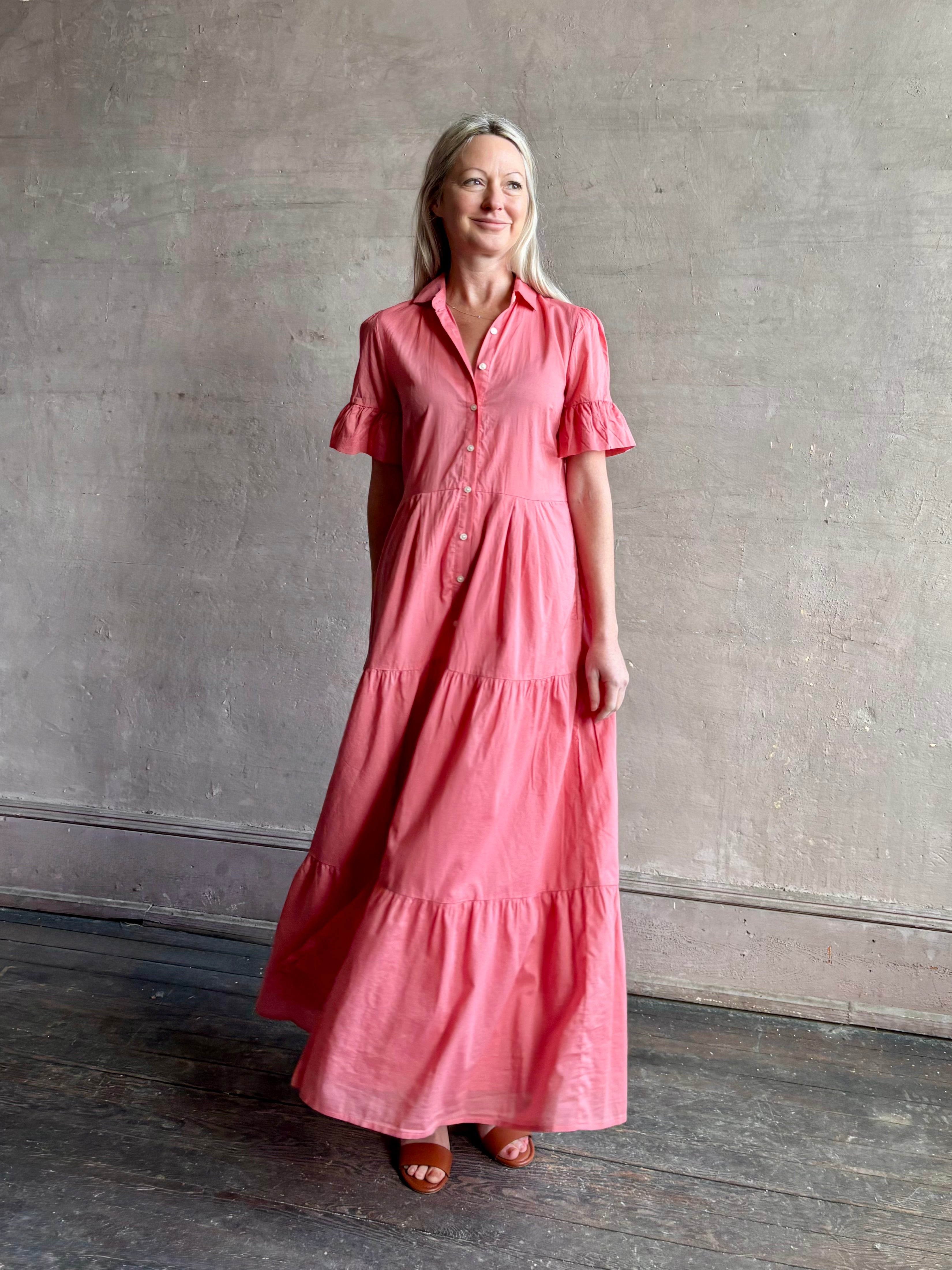 Image of woman wearing  TROVATA Martine button down cotton shirt dress in Rosdo rose with feminine ruffle sleeves and tiered skirt