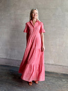 Image of woman wearing  TROVATA Martine button down cotton shirt dress in Rosdo rose with feminine ruffle sleeves and tiered skirt