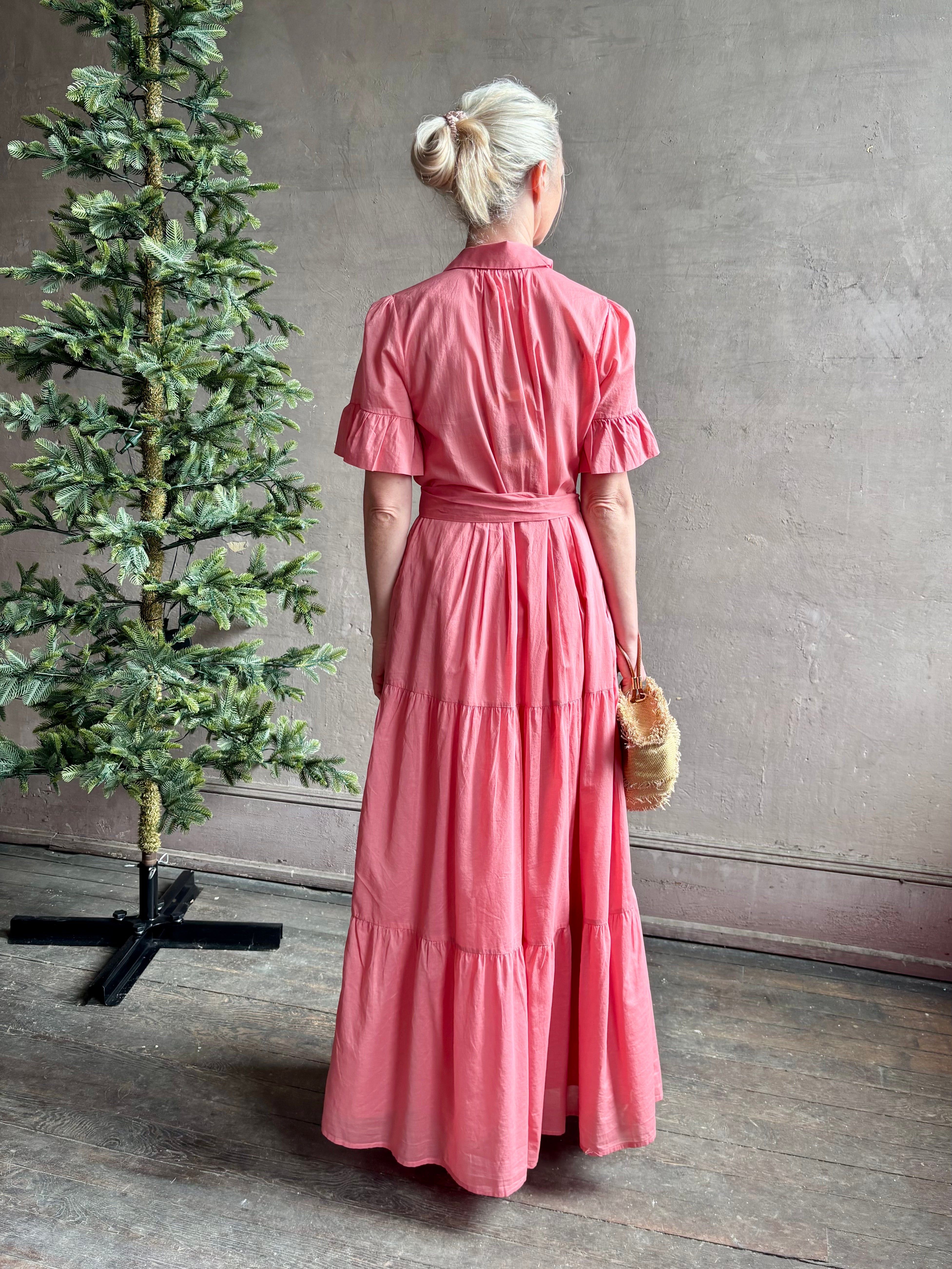 Image of woman wearing  TROVATA Martine button down cotton shirt dress in Rosdo rose with feminine ruffle sleeves and tiered skirt