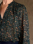 Trovata's Pauline Blouse in Marin Ditsy cotton poplin in navy blue with coral, blue and green small floral print