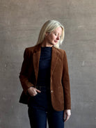 Mature woman wearing Trovata Skylar Cotton Corduroy Two Button Blazer in Walnut Brown front pockets heritage-inspired California tailoring