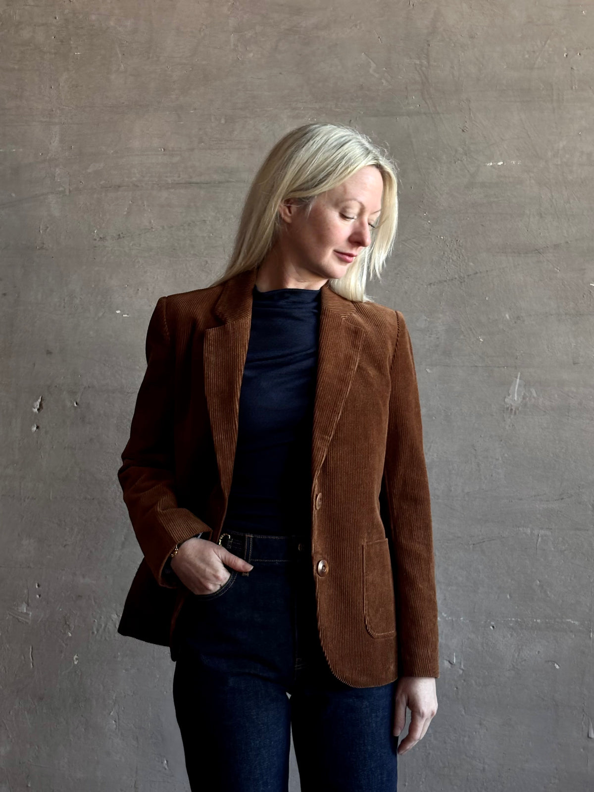 Mature woman wearing Trovata Skylar Cotton Corduroy Two Button Blazer in Walnut Brown front pockets heritage-inspired California tailoring