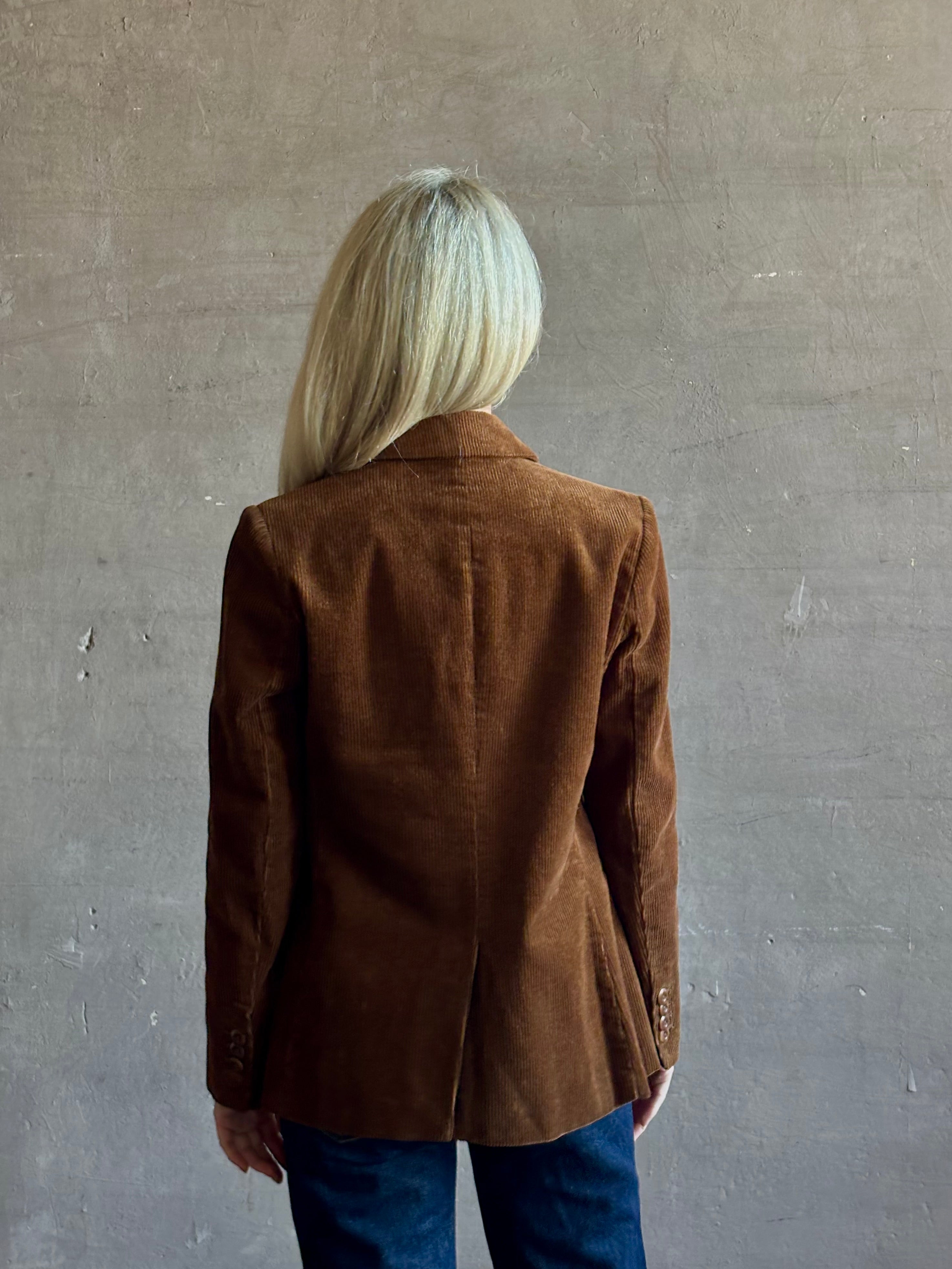 Mature woman wearing Trovata Skylar Cotton Corduroy Two Button Blazer in Walnut Brown front pockets heritage-inspired California tailoring