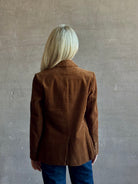 Mature woman wearing Trovata Skylar Cotton Corduroy Two Button Blazer in Walnut Brown front pockets heritage-inspired California tailoring