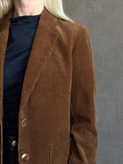Mature woman wearing Trovata Skylar Cotton Corduroy Two Button Blazer in Walnut Brown front pockets heritage-inspired California tailoring