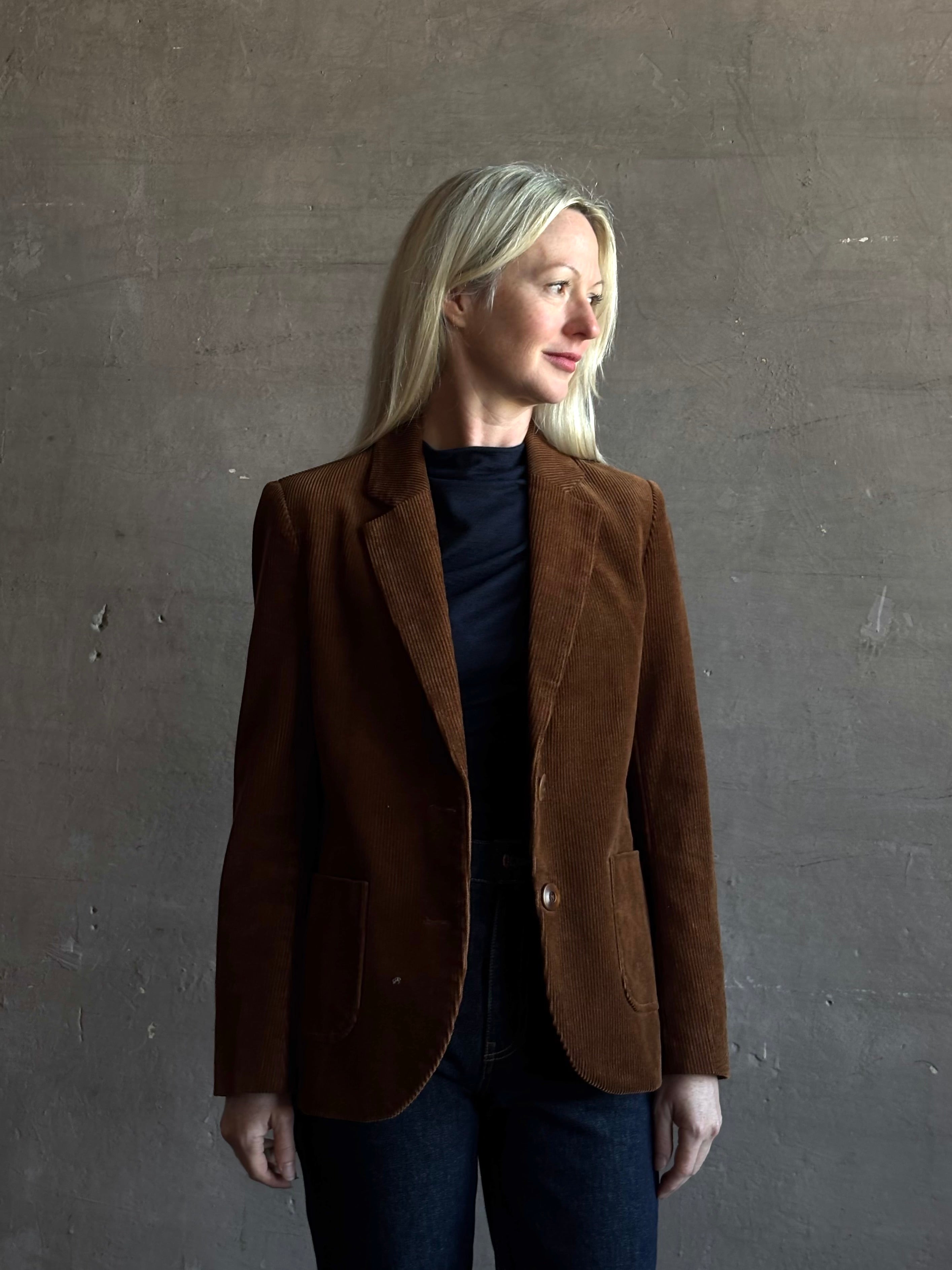 Mature woman wearing Trovata Skylar Cotton Corduroy Two Button Blazer in Walnut Brown front pockets heritage-inspired California tailoring