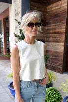 Woman wearing contemporary luxury fashion TWP lamb skin off white Leather Tank top  elevated casual wear