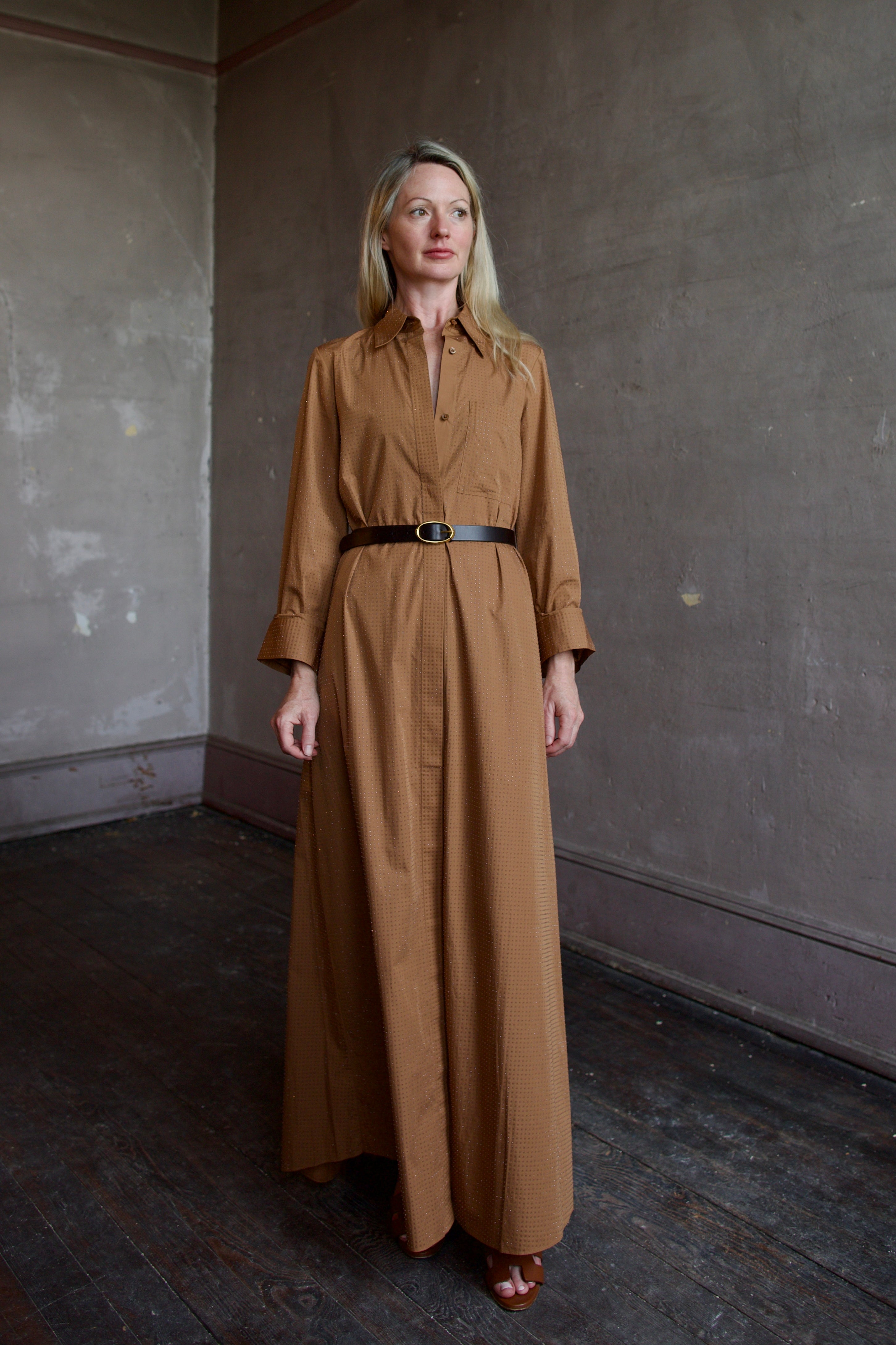 Model wearing the sophisticated TWP Jennys shirt dress embellished with crystals in warm brown and styled with a belt