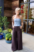 Image of a woman wearing the TWP Jillian Bustier and Dees Trousers