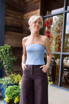 Image of a woman wearing the TWP Jillian Bustier and Dee's Trousers