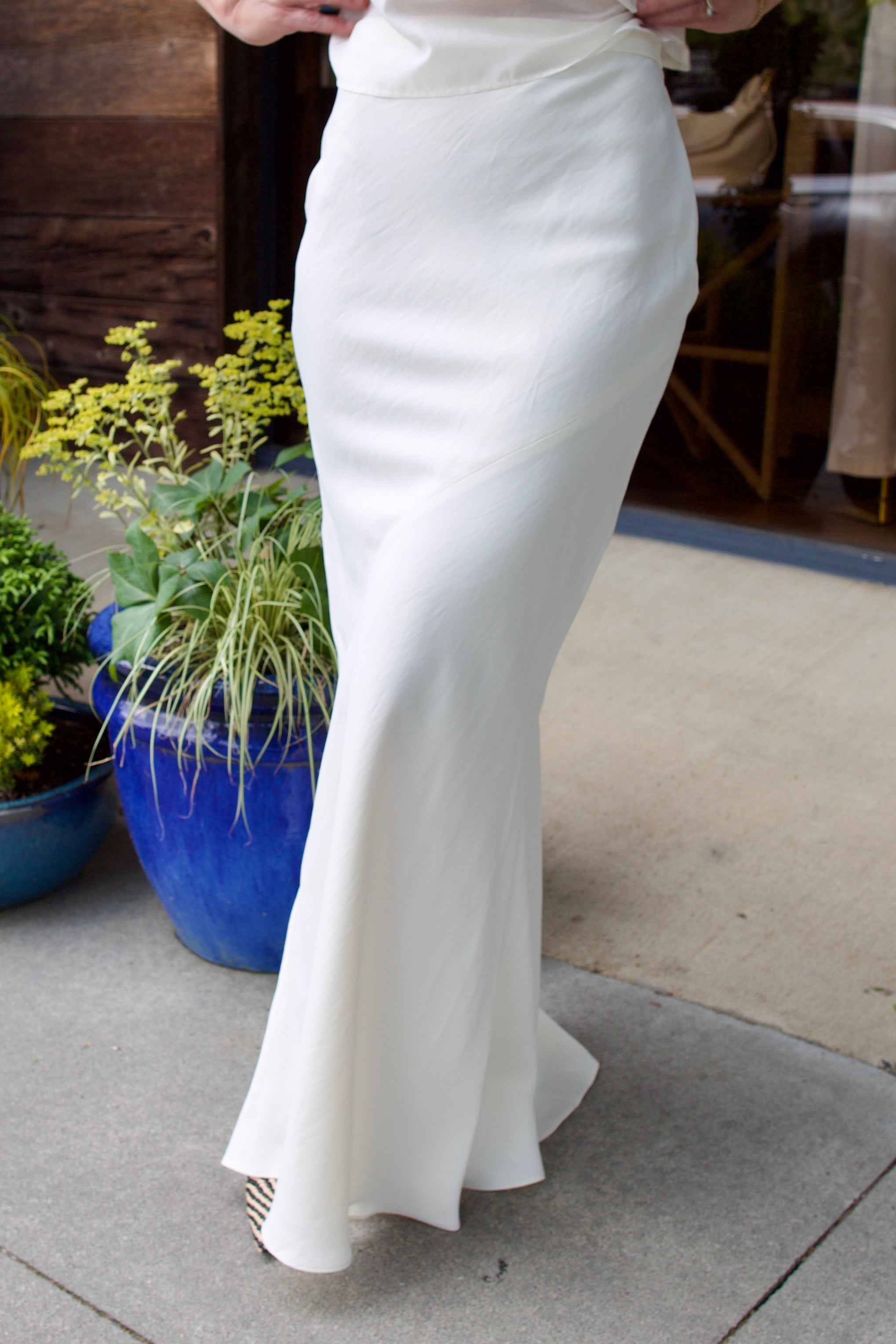 Image of a model wearing luxury TWP coated linen My Endless Love Skirt with expert tailoring for a sophisticated silhouette