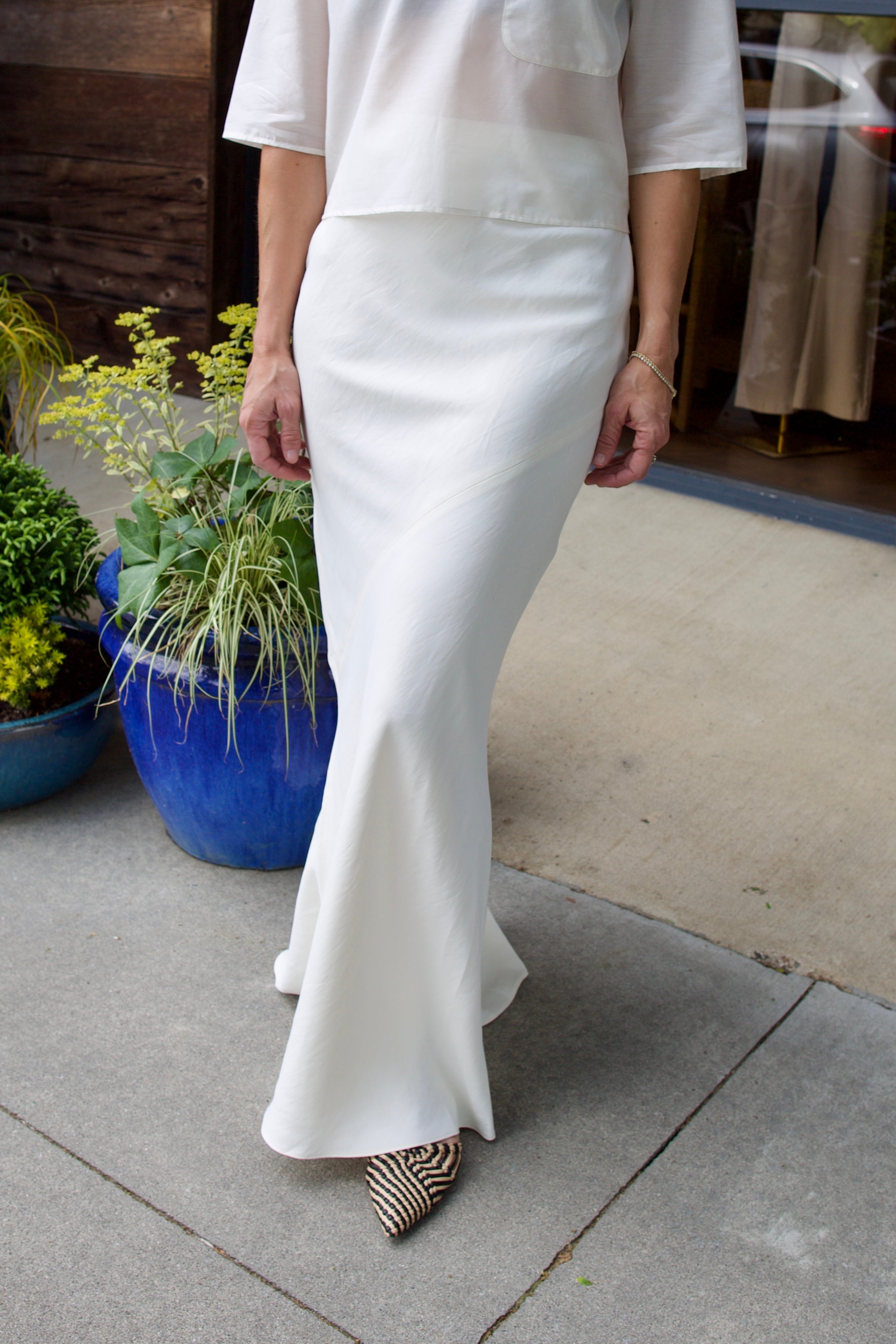 Image of a model wearing luxury TWP coated linen My Endless Love Skirt with expert tailoring for a sophisticated silhouette