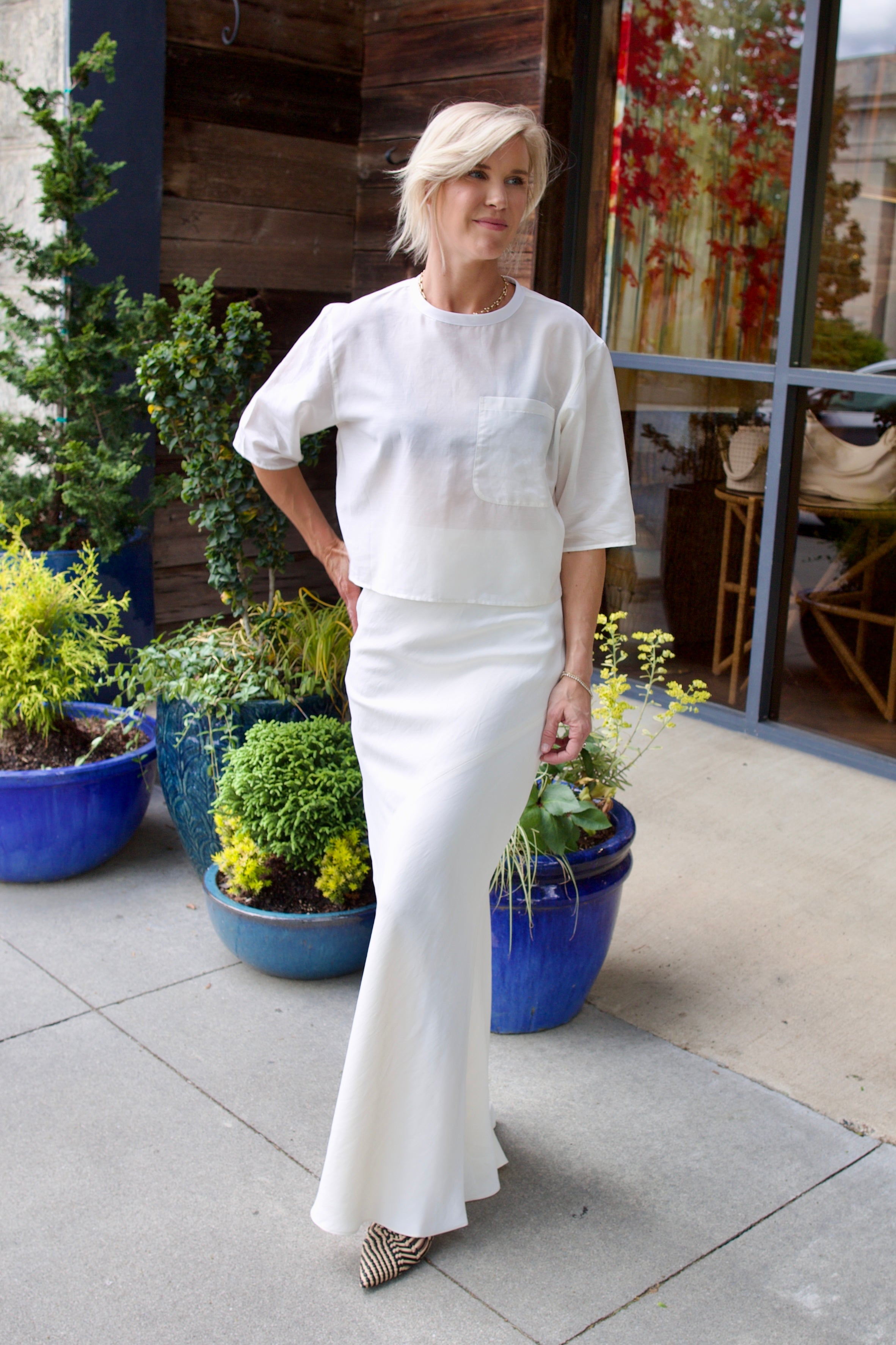 Image of a woman wearing the TWP New Ex Tee and My Endless Love Skirt