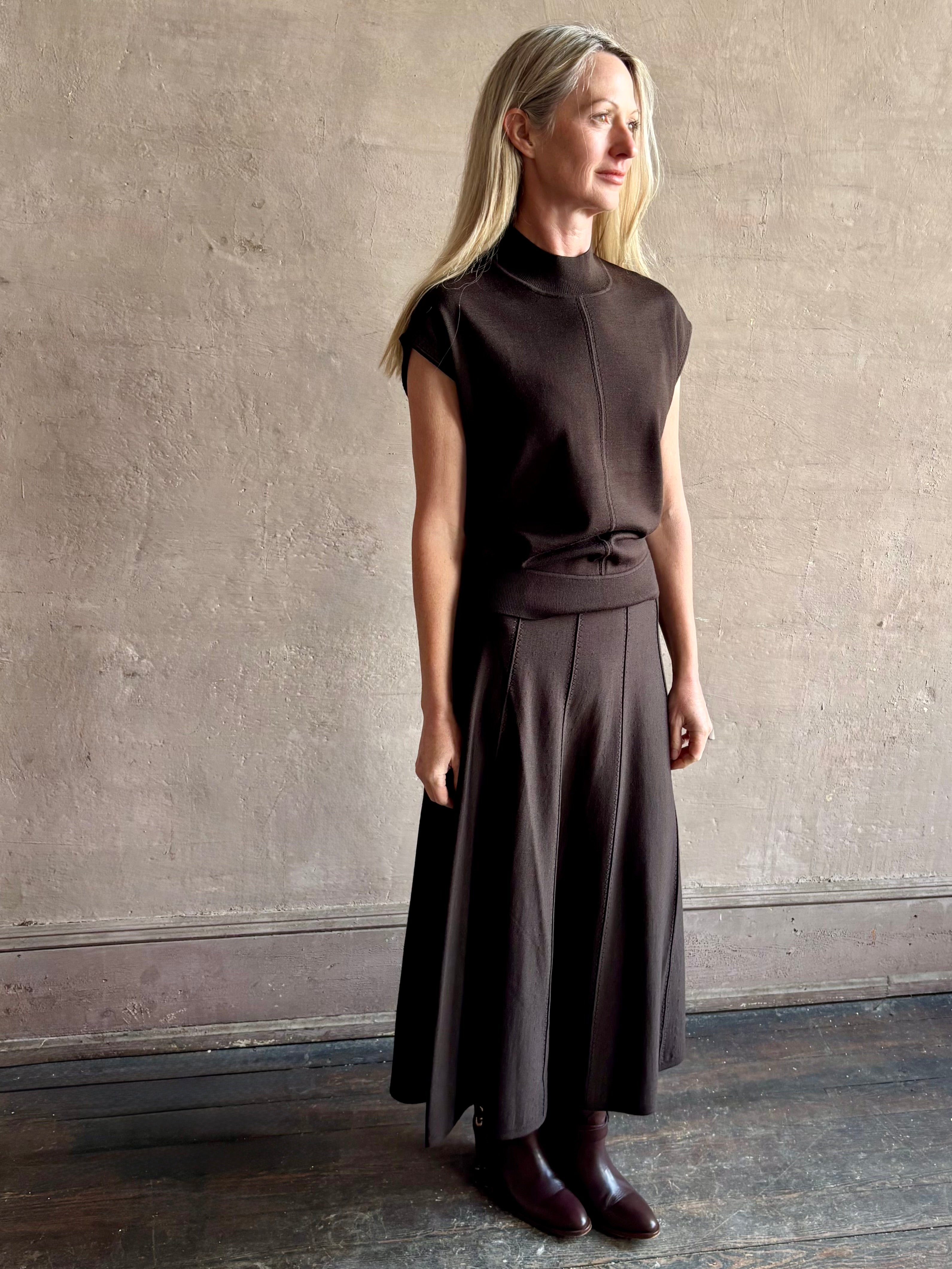 Woman wearing TWP Chocolate brown Wren Sweater  and matching skirt set in  Premium Merino Wool  Knitwear 