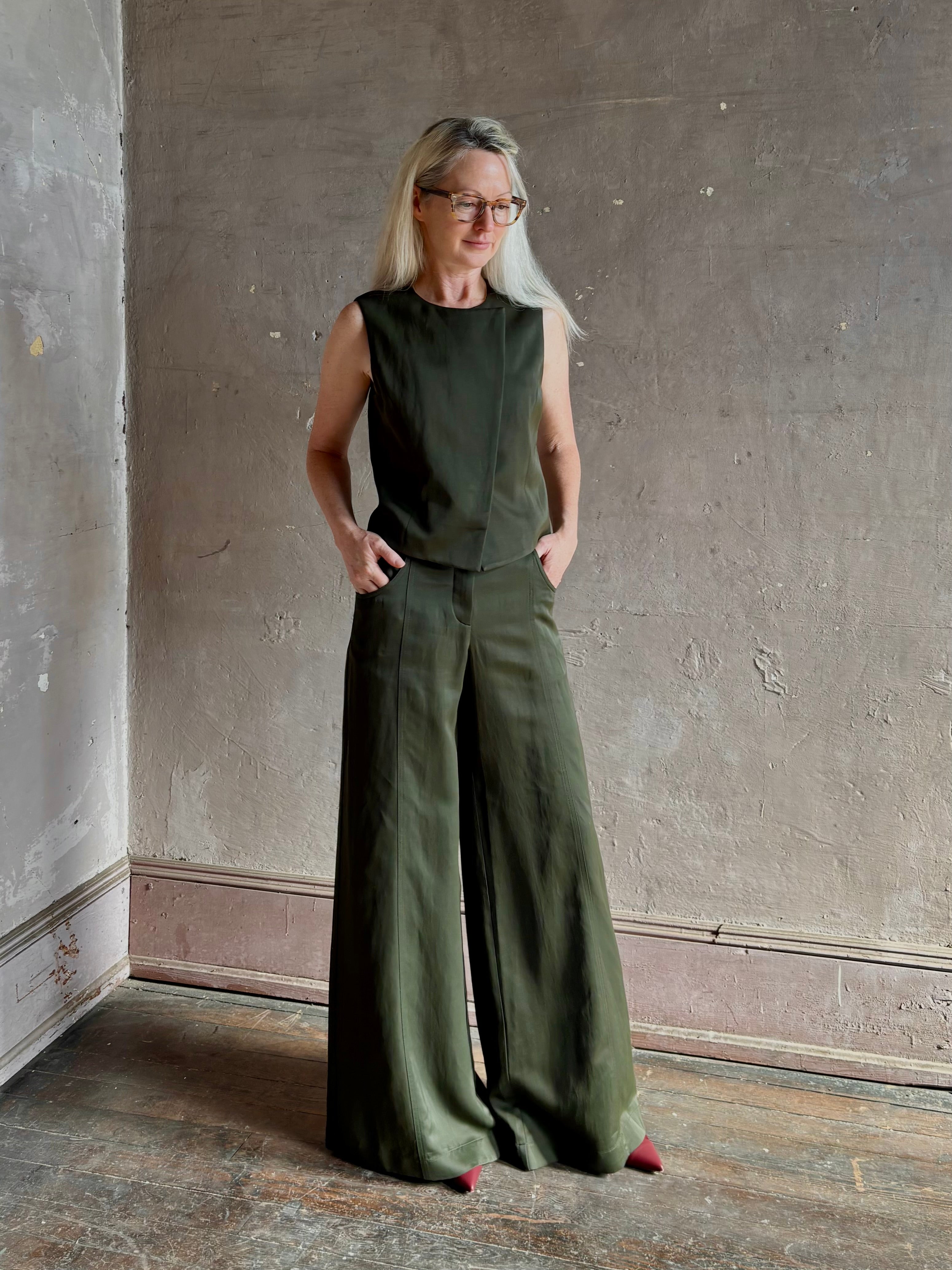 Mature woman wearing luxury women's clothing brand TWP Green Demie wide leg trouser linen viscose blend fabric
