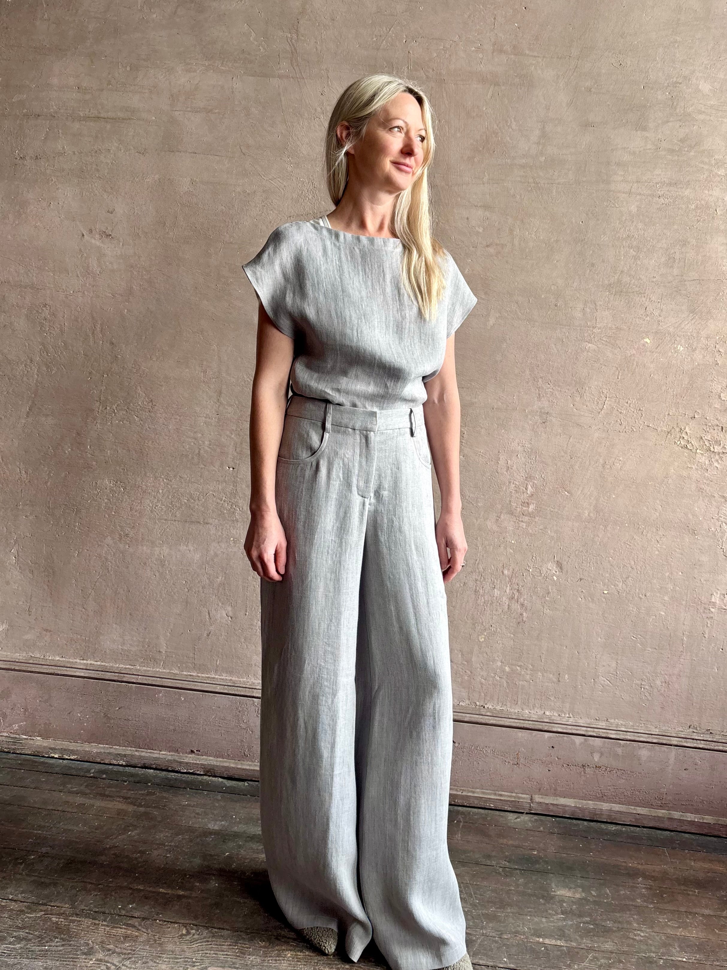 Mature woman wearing the Dillon pant from TWP in an effortlessly sophisticated hemp trouser with an airy wide leg and back pockets
