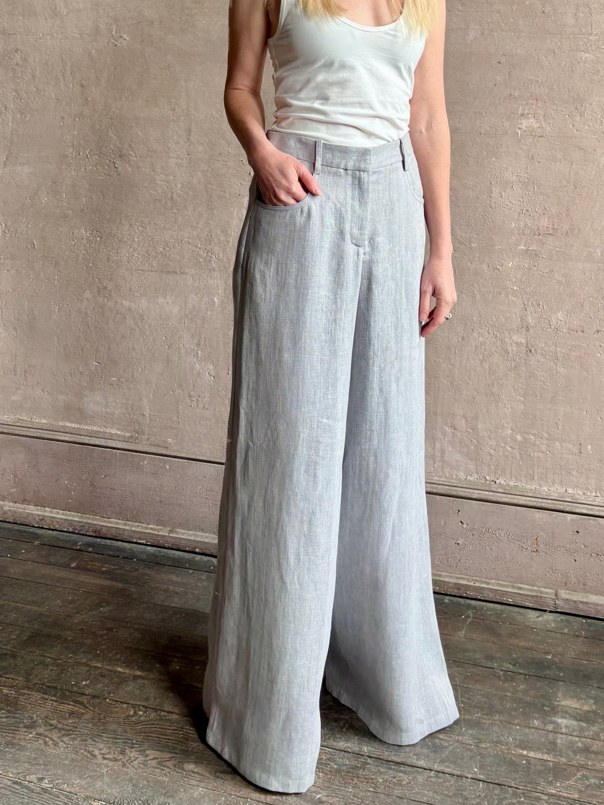 Mature woman wearing the Dillon pant from TWP in an effortlessly sophisticated hemp trouser with an airy wide leg and back pockets