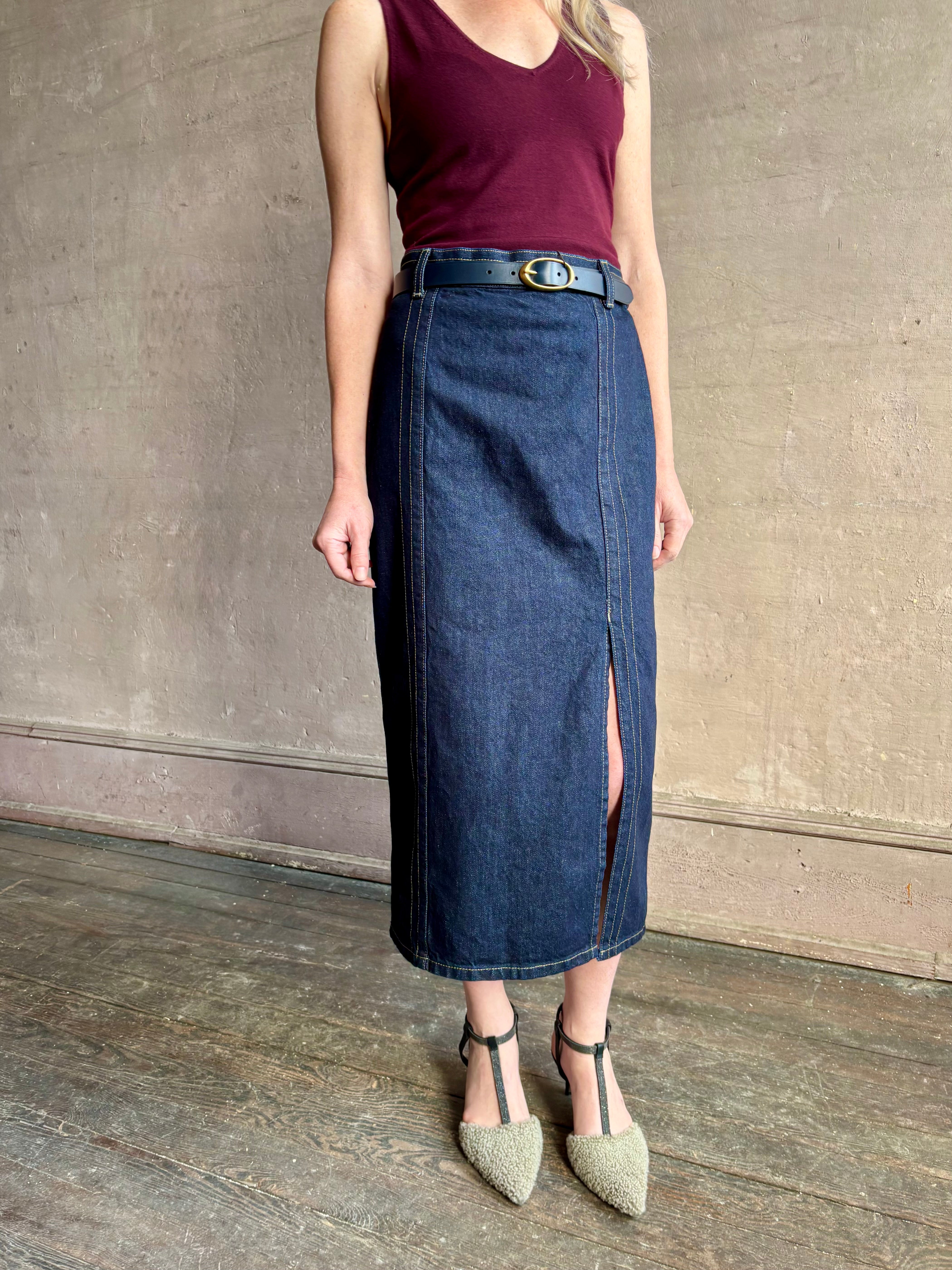 Image of mature woman wearing Premium Cotton American-Made Denim  maxi skirt by TWP with Seams and front vent in Dark Stone wash