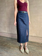 Image of mature woman wearing Premium Cotton American-Made Denim  maxi skirt by TWP with Seams and front vent in Dark Stone wash